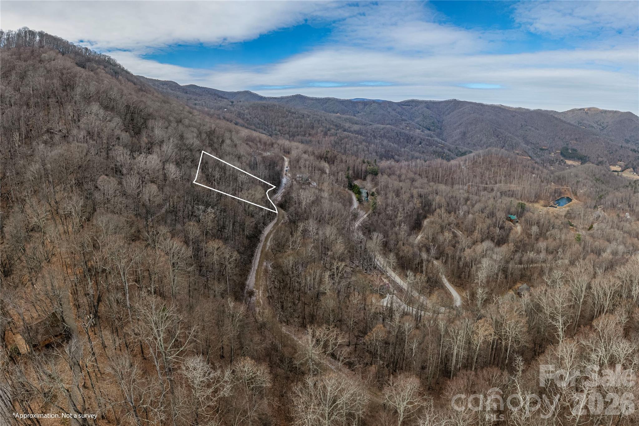 Surrounded by sweeping mountain vistas, this lot in the exclusive gated community of Cataloochee Mountain Estates offers a rare opportunity to create your mountain dream home. With selective clearing, this property becomes an ideal canvas for bringing your vision to reality. Residents of this picturesque community enjoy a variety of amenities, including a pond and a designated common area for picnics and outdoor activities. Convenient to Cataloochee Ski Lodge, Cherokee, I-40, Waynesville, Maggie Valley, and TN.