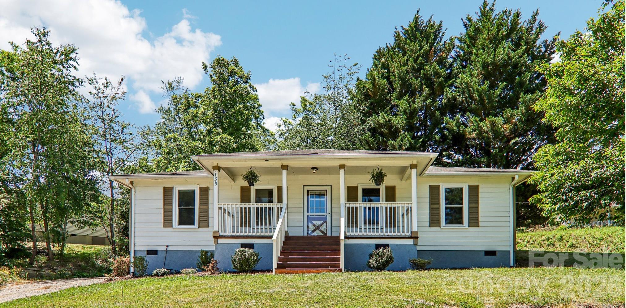 Must-see Weaverville gem where location, lifestyle, and modern updates come together. Ideally situated on a spacious lot just moments from Lake Louise and charming downtown Weaverville, this beautifully updated one-level home offers the perfect blend of comfort and convenience. Enjoy lake access, community events, classes at the Weaverville Community Center, and all  the shopping and dining that Weaverville has to offer — with downtown Asheville only 15 minutes away.
Start your mornings or unwind in the evenings on the inviting covered front porch.  Inside, this move-in ready home features a bright open-concept floor plan with 3 bedrooms and 2 full baths.   The updated kitchen features granite counter tops and newer appliances. 
Extensive recent improvements provide peace of mind and low-maintenance living, including new PEX water lines, a new main water line from the meter to the home, luxury vinyl plank flooring, fresh interior paint, energy-efficient windows, updated interior doors, energy-efficient storm doors, and a leaf guard gutter protection system
Whether you are searching for a full-time residence, mountain retreat, or investment opportunity with vacation rental potential, this home offers exceptional versatility in one of Western North Carolina’s most sought-after communities. Rarely do homes with this combination of location, updates, and lifestyle become available — schedule your showing today.