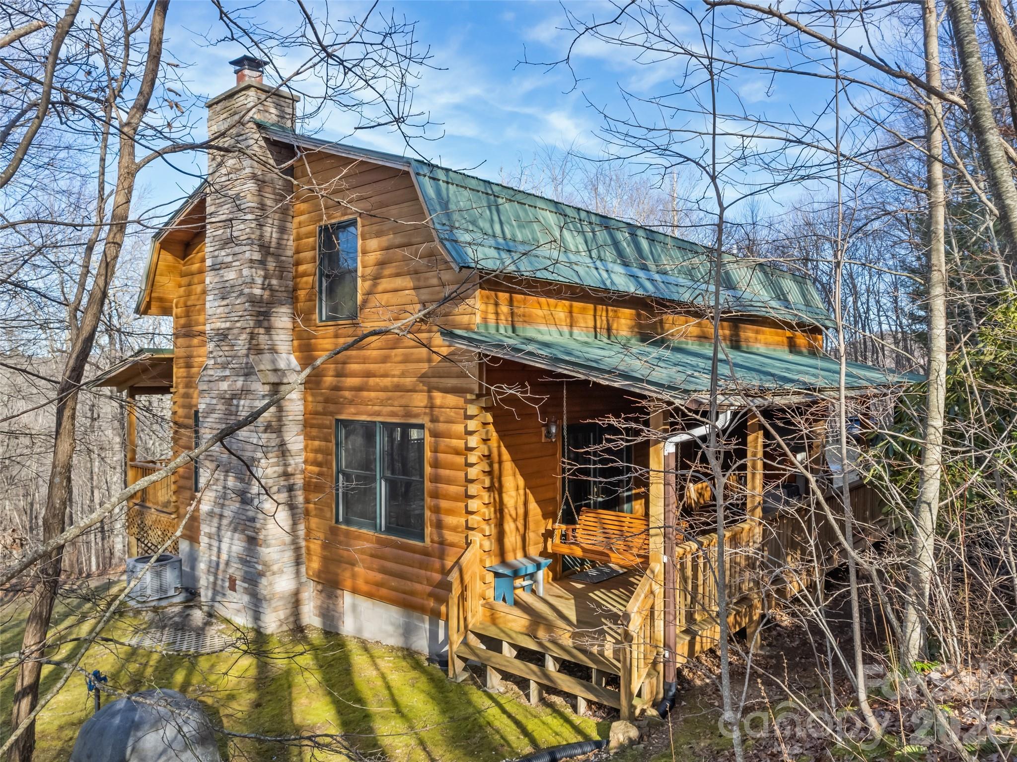 INCREDIBLE PRICE ADJUSTMENT!! You know the air is crisper and the stars are brighter at this incredible, custom log home in Franklin!  Sitting at over 3900', your view of the world takes on a new meaning as you relax on the front porch, breathing in the fresh mountain air. With a smart, thoughtful layout, the kids or extra guests can hang out upstairs in the landing or in their rooms, while the others can enjoy the wood-burning fireplace or the outdoor spaces. This 3 bedoorm, 2.5 bathroom has abundant sunlight and privacy, yet it's a quick trip to the Appalachian Trail, Standing Indian Campground, a local gem mine, or a river teeming with trout. Head to Franklin for a delicious meal and trendy shopping, or zip to Lake Chatuge or to Harrah's Cherokee Casino. Experience the tranquility and adventure for yourself and scoop up this amazing property before it's gone! MOTIVATED SELLERS - MAKE AN OFFER!