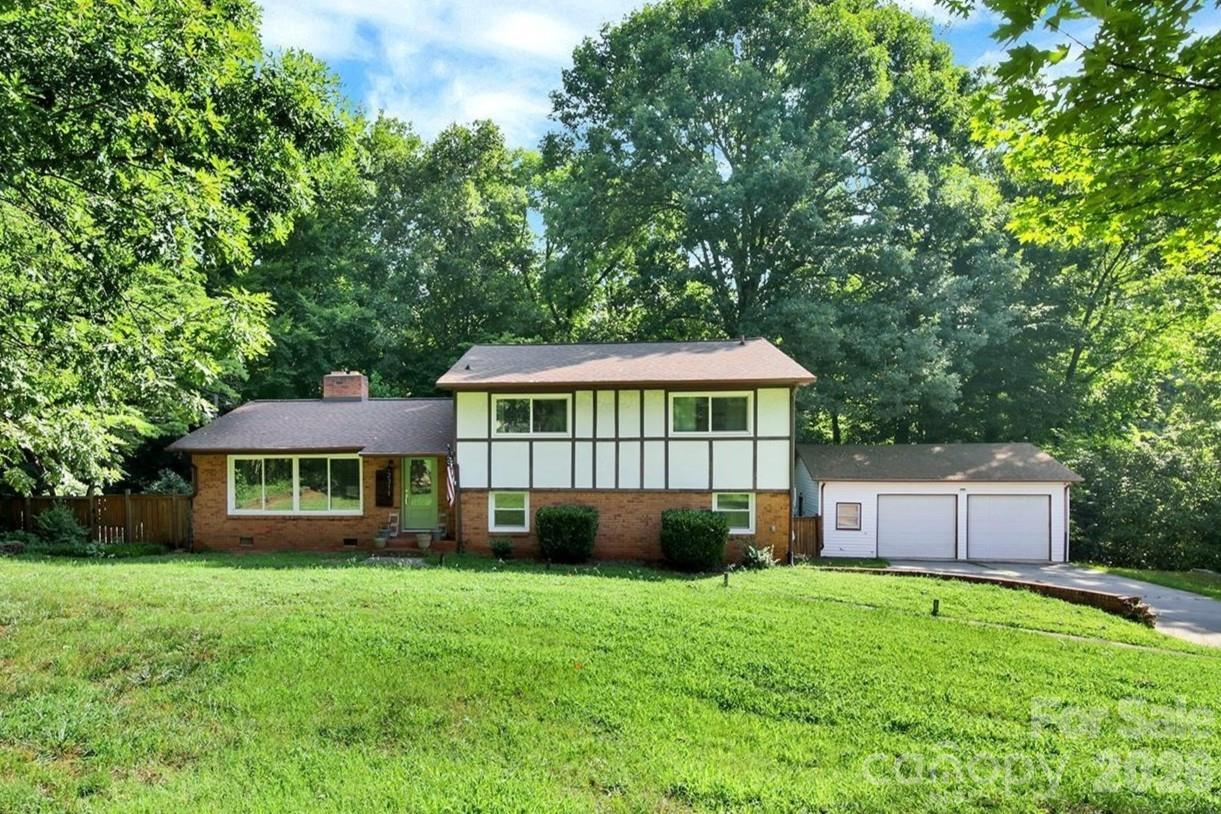 Welcome home to spacious 2311 Laurelwood Circle. Offering some of the largest square footage available in the neighborhood, inside you’ll find hardwood floors, generously sized living areas, and a large downstairs flex space that can serve as a home office, playroom, gym, or additional entertaining space.
Step outside to enjoy the private screened-in back porch, perfect for relaxing or hosting guests, along with a large detached two-car garage that provides plenty of room for parking, storage, or a workshop.

Located in a quiet, established neighborhood and zoned to Tuckaseegee Elementary, this home offers exceptional convenience to Charlotte Douglas International Airport, Uptown Charlotte, shopping, dining, and major commuter routes. With its flexible layout, impressive size, and highly convenient location, this home is a rare opportunity for buyers seeking space without sacrificing accessibility.