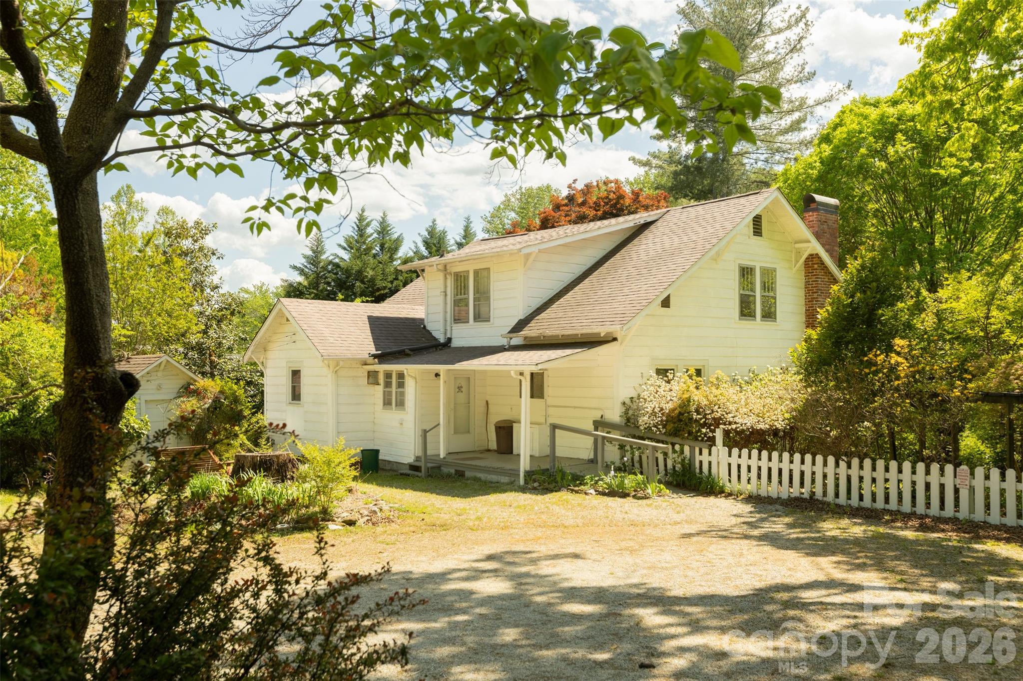 You’ll find the most colorful azaleas and native wild flowers in this historical Marion farm house. Just minutes from downtown the location can’t be beat. You have privacy and space but are so close to everything. Steeped in traditional charm, this home is waiting for the love it deserves for weathering the generations. There is so much space to make your own. You’ll find the option for a primary on the main floor and another bedroom or study/library in addition to a large dining area and living room off of the kitchen. Upstairs there are 4 different bedrooms, two smaller and could be used for offices or hobby space if preferred. The outdoor space is the most gorgeous country, idyllic living that literally comes with a white picket fence! The property is filled with mature trees and native wildflowers. You don’t have to look hard to find trillium, red buckeye bushes, golden yellow, fuchsia, pink, white, purple and magenta azaleas. 10 minutes to Lake James, less than 30 minutes from Black Mountain or Morganton. Come make this home your country oasis today!