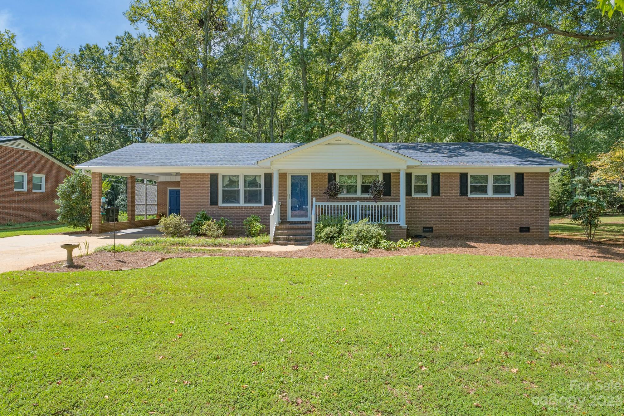 This quaint ranch home has been well-maintained by the current owner for over forty years.  The front entrance welcomes you to a nice sized living room that leads to a cozy den with brick fireplace where you can enjoy those fall and winter evenings.  A small breakfast area and kitchen are entered through the den.  Three bedrooms, a full bath, and a half-bath located in the primary bedroom, complete this home that is filled with potential for buyers.  This full-brick home with a single carport is in a great neighborhood with no HOA and is close to Winthrop University and Cherry Park.  Come see all it offers for you!