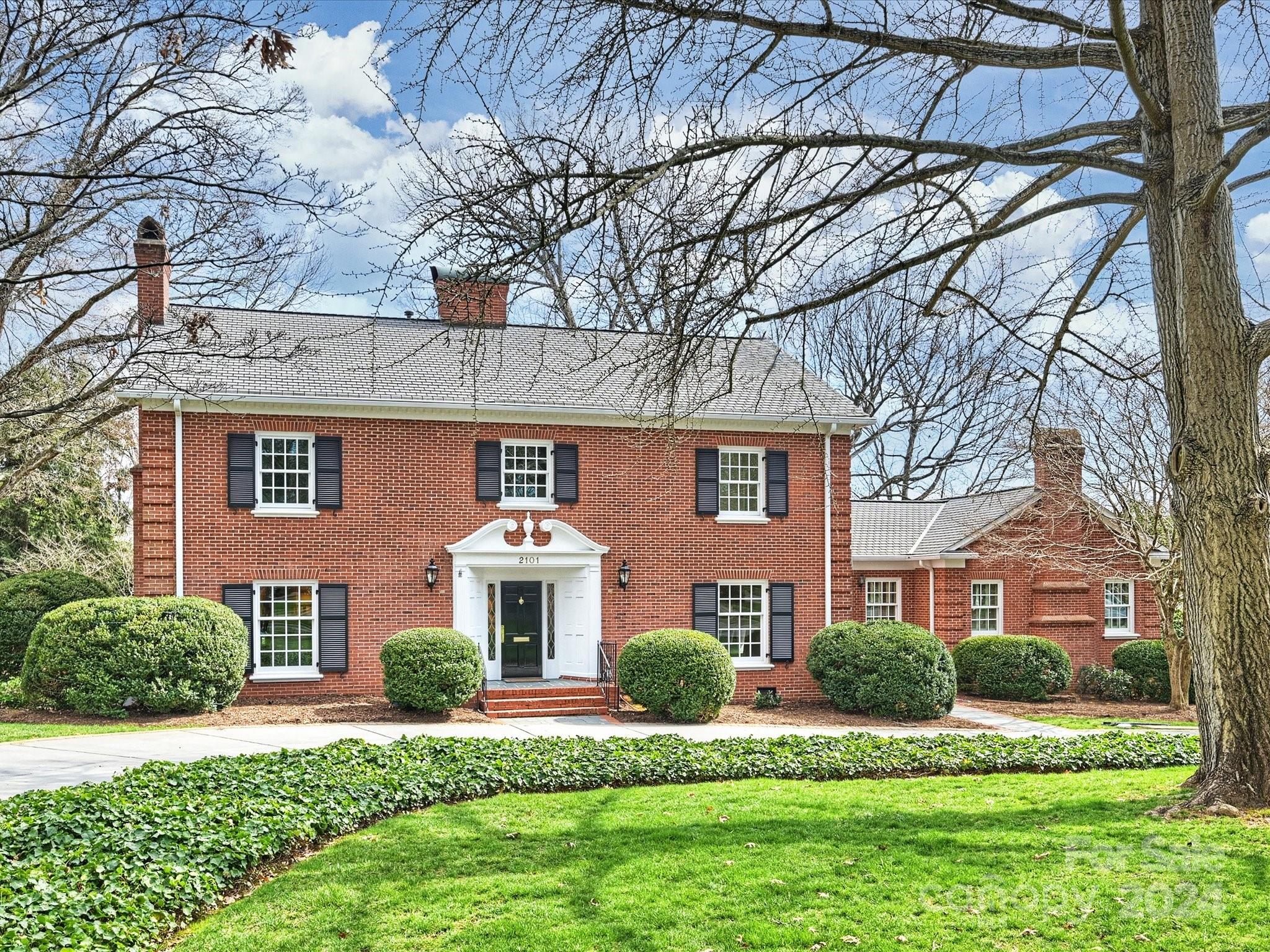 This lovely 2 story traditional brick home sits on a wonderful .8 acre lot in Myers Park. Large rooms with windows overlooking beautiful landscaping. Off of the marble floored entry is a large living room with a gas fireplace as well as a large dining room. Additionally, there is a spacious family room, guest suite/fourth bedroom. Separate side entrance opens into mud room with laundry area off of the kitchen. Kitchen has built-in Sub Zero refrigerator/freezer, 2 separate ovens and a gas cooktop.There is also a fabulous media/playroom/workout room downstairs with french doors leading outdoors. Upstairs features the primary suite with separate dressing room, additional two bedrooms with a connecting bath. Incredibly beautiful back yard with terraced gardens just a block from Queens University.
