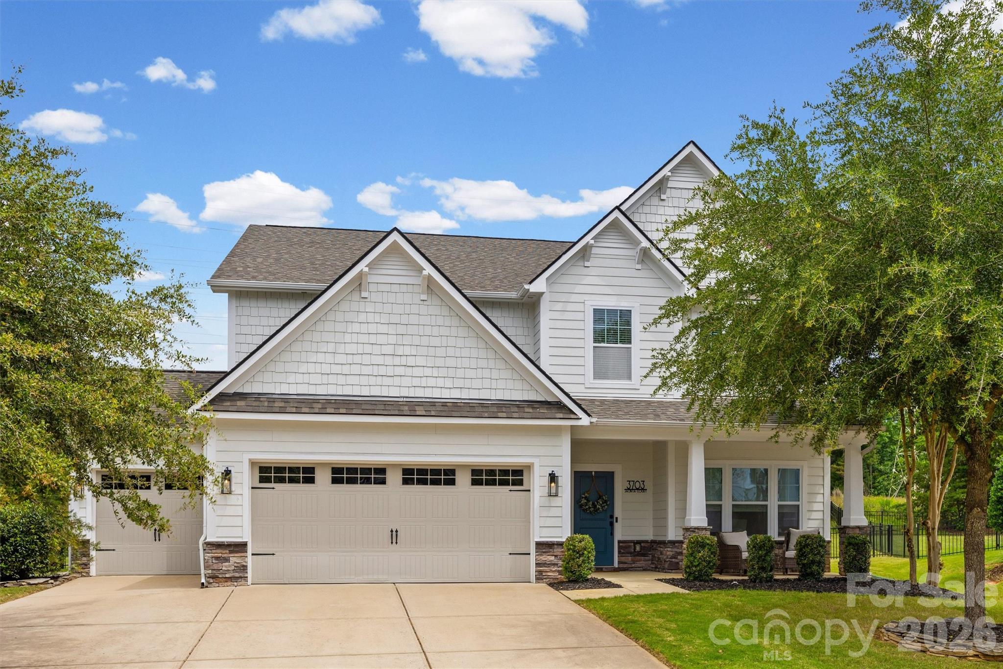 Nestled in the heart of Fort Mill and the highly sought-after Lake Ridge community, this stunning home offers the perfect blend of cozy comfort and modern convenience. Situated at the end of a quiet cul-de-sac, the home boasts exceptional curb appeal and a private, fully fenced backyard with no neighbors behind you. Inside, you'll find a bright and inviting open-concept floor plan where the kitchen, dining, and living areas seamlessly come together. Abundant natural light fills the space, creating the perfect setting for everyday living and effortless entertaining. Just inside the entry from the garage, a thoughtfully designed drop zone with a bench, cubbies, and hooks helps keep backpacks, coats, and activity gear organized. The main level also features a versatile flex space tucked away at the back of the home, ideal for a private home office, or playroom, along with a convenient half bath for guests. Upstairs, all of the bedrooms are thoughtfully located on one level, along with a spacious bonus room and an oversized laundry room conveniently situated just steps from each bedroom. The secondary bedrooms provide plenty of room for everyone to spread out and enjoy. The screened porch overlooks the large fenced backyard, offering the perfect place to enjoy your morning coffee, unwind after a long day, or host guests. Completing the home is a desirable three-car garage, providing ample storage and parking space. Beyond the home itself, Lake Ridge residents enjoy a resort-inspired lifestyle featuring an Olympic-sized pool, tennis and basketball courts, scenic walking trails, and abundant opportunities to connect with neighbors and enjoy the outdoors. One of the best parts of living in Lake Ridge is the unbeatable location. Just a short golf cart ride away, The Grove at Tega Cay is a highly anticipated mixed-use development currently under construction that will feature boutique shopping, dining, offices, entertainment, and community gathering spaces. Enjoy the convenience of being close to this exciting future destination while still being just minutes from downtown Fort Mill and a short drive to Charlotte.