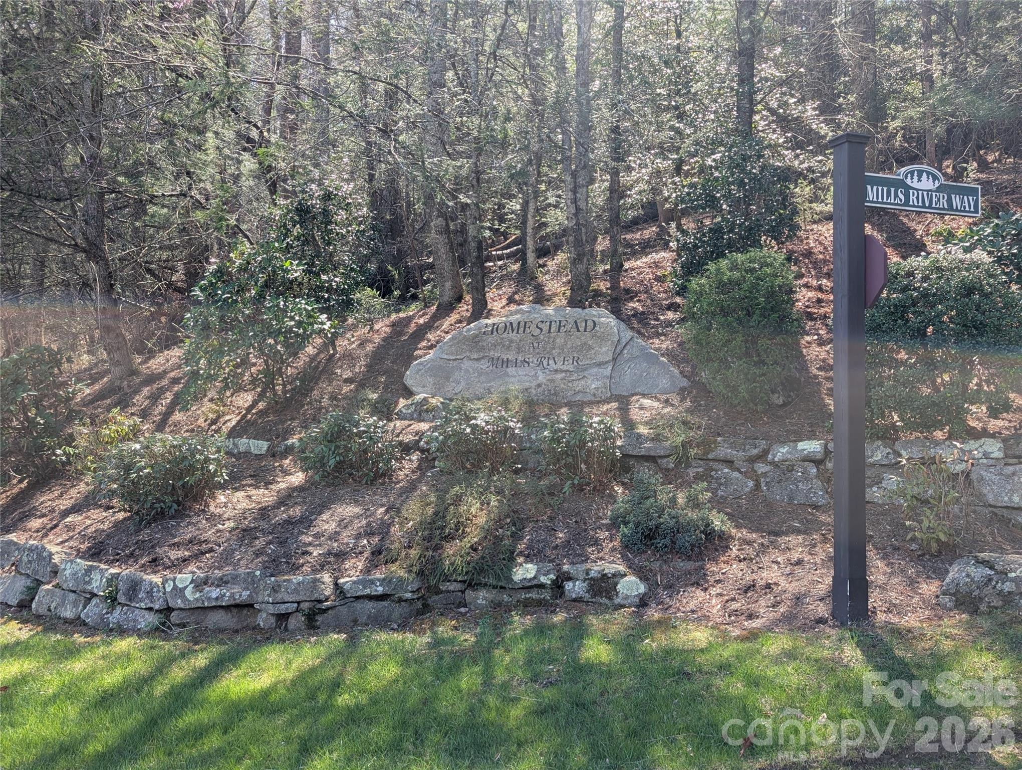 Build your custom mountain estate on this expansive 1.75-acre homesite featuring incredible long-range view potential within the prestigious, gated community of the Homestead at Mills River. Known for its architectural excellence and upscale homes, this prime parcel offers the perfect balance of a private, wooded sanctuary and high-end neighborhood luxury. The location is remarkably convenient, situated just outside the Pisgah National Forest for endless outdoor recreation, yet only 15 minutes from the Asheville Regional Airport and a short drive to the region’s best shopping, dining, and breweries. Residents enjoy top-tier community amenities, including gated security, paved roads, and underground utilities with natural gas, as well as exclusive access to the private Homestead River Reserve—a 10-acre riverfront park featuring a clubhouse and prime fishing spots. This is a rare opportunity to capture the stunning Blue Ridge horizon and experience the very best of Western North Carolina living.