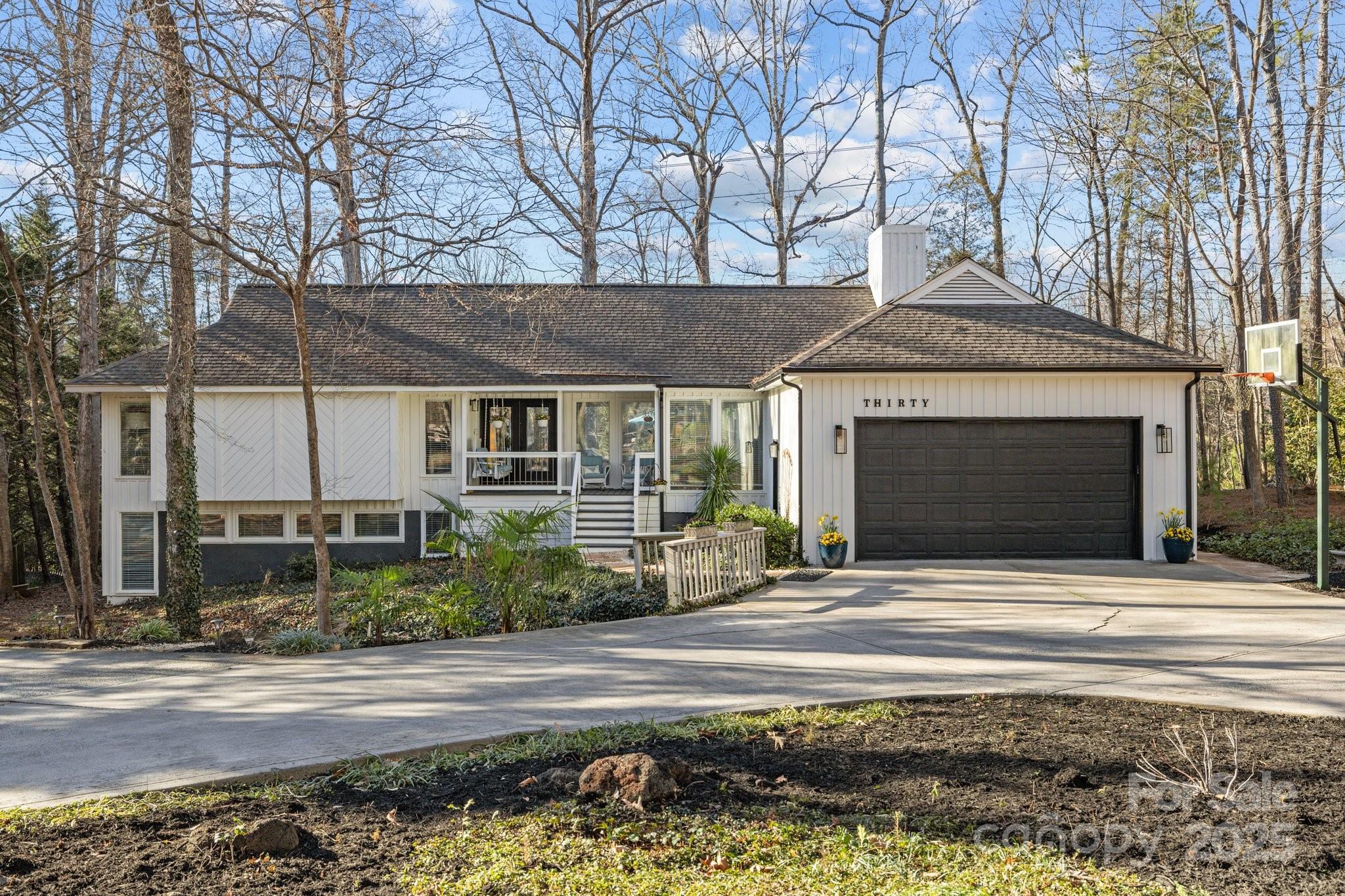 Prepare to be impressed with this beautifully renovated home in River Hills on a half acre lot with tons of privacy and a U-shaped driveway. The gourmet kitchen features beautiful white cabinets, quartz counters, a large center island and stainless appliances that are all less than a year old. Every room of the home has large windows for tons of natural light, and the living room features a grand stone gas log fireplace. The primary suite opens to the back deck and features a large tile shower, a standalone tub, double sinks and a large closet. The secondary bedrooms are generously sized and are connected by a newly renovated jack-n-jill bath with a new vanity and tile shower. The lower level features an oversized bedroom, a full bathroom and a large great room w/ a kitchenette. The expansive deck leads to a backyard oasis with a stone fireplace, a fountain, a covered seating area and an outdoor kitchen. Gated Golf Course Community, Lake Access, Low Lake Wylie taxes and Clover Schools!