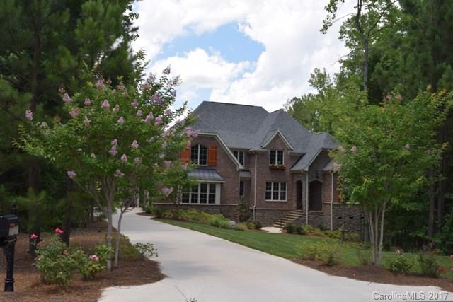 Gorgeous home with tons of upgrades offers luxury living at its best! Outdoor living space includes large screen porch with a fireplace, salt water inground pool and hot tub, outdoor shower and half bath, fenced back yard. Hardwood and tile flooring throughout entire home. Gourmet kitchen has stainless appliances with gas cook top, large breakfast bar. Beautiful coffered ceiling in great room. Master and guest bedroom on main. Huge bonus and additional bedrooms up with a great workstation.