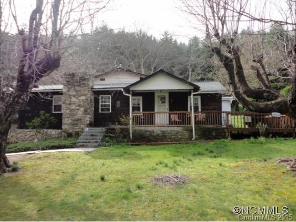 Farmhouse w/peaceful mountain views. Rural setting, close to creeks, hiking, shopping, Hwy 70, I-40, Warren Wilson college, and ACA. Living room has large stone fireplace. Recent remodel: new kitchen, laundry room, library, tile and wood-look laminate flooring. Private master w/access to back patio. Beautiful 0.5 acre, mostly level, w/grapevines, pear, and cherry trees. Oversized 900 SF double garage w/power & additional workshop space.