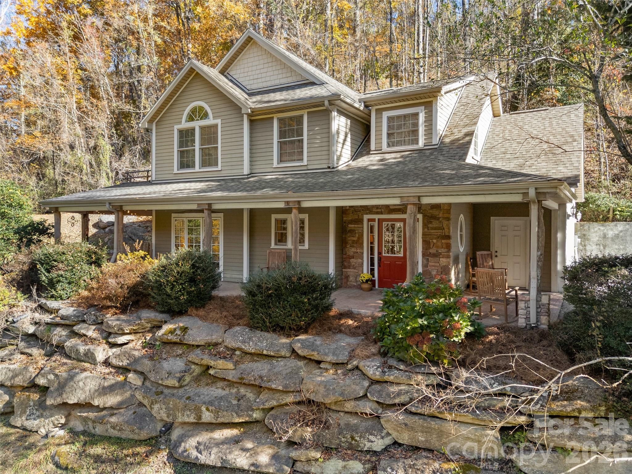 Discover this custom 3BR/2.5BA, beautifully maintained home in Fletcher—perfectly positioned to capture amazing mountain views and designed for comfort, style, and effortless entertaining.
Fresh new paint throughout and a new roof set the stage for a move-in-ready experience. The expansive covered wrap-around patio is ideal for gatherings, morning coffee, or relaxing evenings, and the patio furniture conveys with the home. The fenced yard adds convenience for pets and outdoor enjoyment and plenty of room to garden, have a swingset, or just to run around in!
Inside, you’ll find no carpet anywhere—just timeless tile and hardwood flooring. The lower level features heated floors, keeping your feet (and pets!) warm during the cooler months. Additional upgrades include a tankless water heater, central vacuum system, and a security system that conveys (currently inactive). The washer and dryer convey, and the hot tub conveys as well.
The living room offers a cozy wood-burning fireplace, while the spacious primary suite includes its own gas fireplace, adding a romantic touch. Just off the primary bedroom—and also accessible from the office/bonus room—is a newly tiled upper-level outdoor space with beautiful views, perfect for enjoying morning tea or coffee or unwinding with an evening glass of wine. One of the bedrooms has an exterior door. This room could be used as an STR (buyer to confirm), exercise room, game room, sitting room, or third bedroom. 
A termite bond conveys with the sale for added peace of mind.
This custom home is located just minutes from coffee, a gas station, and a wine market, with quick access to everything Fletcher has to offer. You’re less than 20 minutes to downtown Hendersonville and 30 minutes to downtown Asheville, making this an ideal blend of tranquility and convenience!