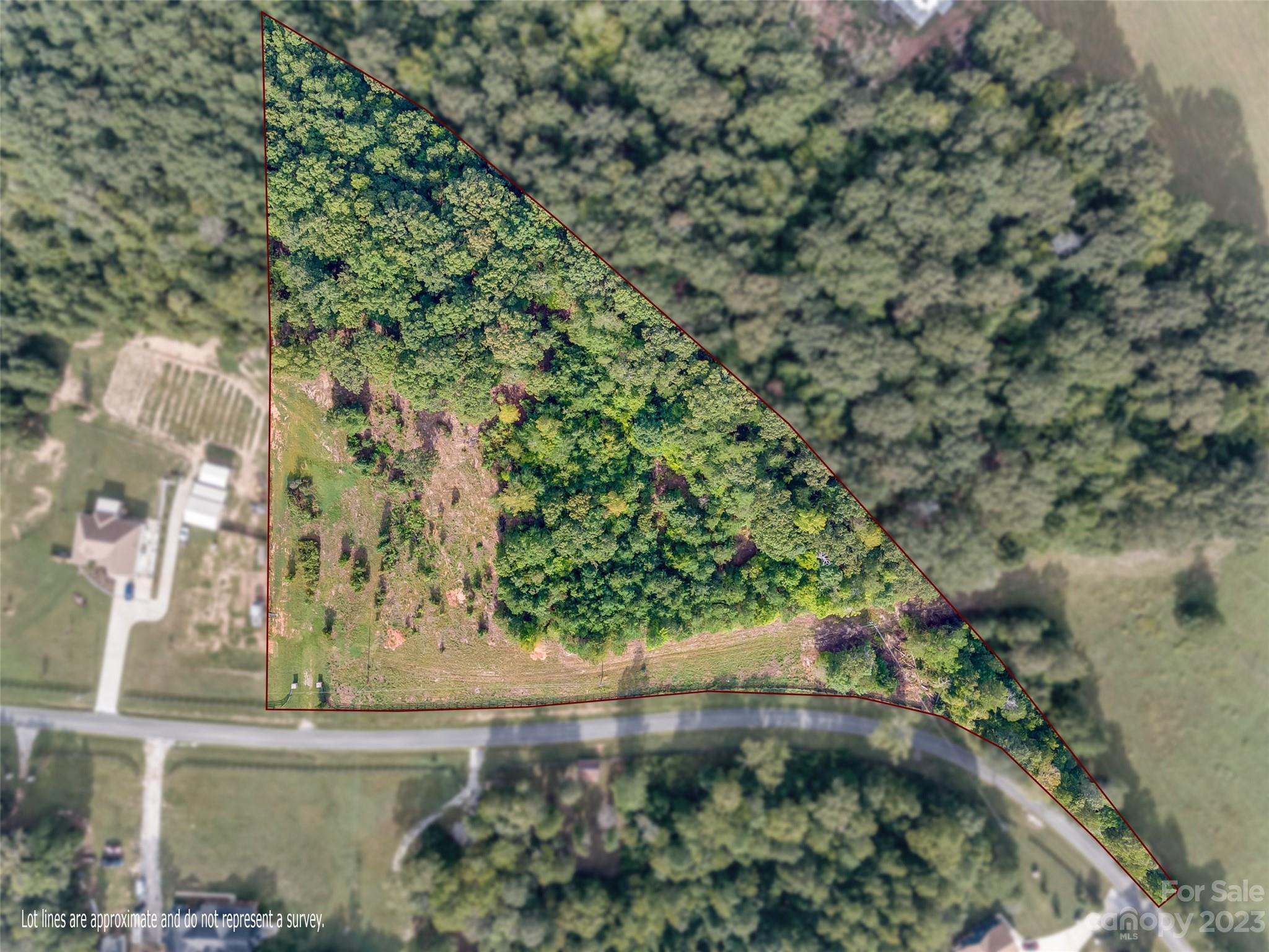 Quiet country living is in your future. Past the fence and through the stone columns you will find 5+ acres to build what your heart desires! No HOA, and partially cleared with Septic permit in hand.