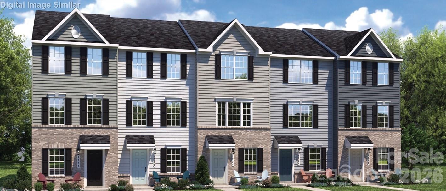 Own this stunning 3 story townhome with garage, tucked away in a quaint, peaceful community just minutes from University City, I-85, and I-485. This open concept home features a sleek kitchen on the 2nd level with espresso colored cabinets, granite countertops with an additional bar area, a center island, and GE Stainless Steel Appliances-including a refrigerator. This townhome has also been upgraded with an additional ½ bath between the kitchen and living area, a hard surface optioned living room floor package and additional LED lighting. Upstairs on the 3rd level, you’ll find the primary suite featuring dual closets, a master bathroom with dual vanities, a 2nd bedroom with a full bathroom, plus a full size front-load GE washer and dryer already included. While most townhomes squeeze all 3 bedrooms upstairs creating tight and cramped rooms with shared bathrooms, our Spencer E model gives you privacy and flexibility with a first-floor bedroom with full bath. This is ideal for guests or a home office giving each bedroom in the home access to its own bathroom. Enjoy the perfect blend of peaceful living and urban convenience in our charming community with easy access to I-85 and I-485 for a quick commute to uptown Charlotte and around the city. Ask about our special financing incentives with our preferred lender.