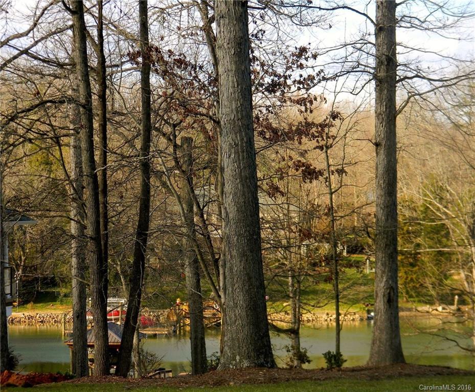 Build your dream Lake home less than 2 miles from Buster Boyd Bridge. Located in highly sought after Heron Cove.  This unique 1 acre lot boasts 243' of road frontage in a cul-de-sac w/ water views from both the front and rear of property.  Wooded lot will help retain privacy on all sides. Temp drive currently bisects lot - please look at photos for approximate lot shape. Heron Cove amenities incl. pool,cabana,trails,lake access,gazebo/rec area. Clover School District!
