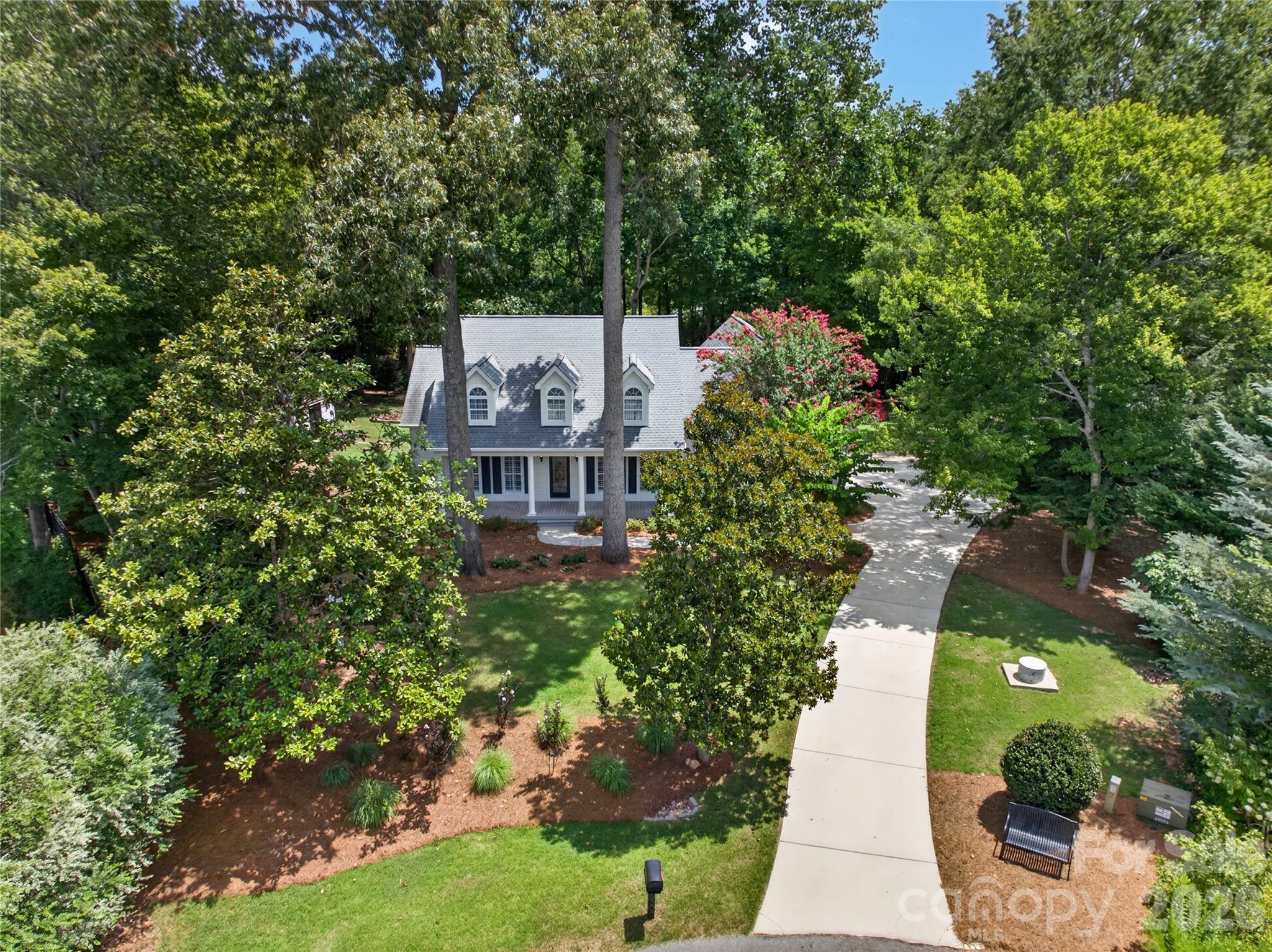 Over 1 ACRE... NO HOA... RANCH + BONUS ROOM Up... CUL-DE-SAC... TOP SCHOOLS!!! Gracious Southern Charm Abounds in This Beautifully Maintained, Custom Home. Gorgeous Mature Landscaping with MAJESTIC OAK TREES... Enjoy the Beauty and Serenity of the Rocking Chair Front Porch Overlooking a Quiet Cul de Sac. Hardwood Floors and Tile Throughout This One Level Home! Entry Hall Opens to Large Dining Room with Crown Molding and Plantation Shutters... Family Room With Soaring Ceiling, Elegant Moldings and Gas Fireplace Opens to Lovely Custom Sunroom Featuring Outstanding Views of The Picturesque Backyard with Access to the Rear Patio... Well Appointed, Gourmet Kitchen is a Chef's Delight! White Cabinetry... Granite Countertops... Custom Tile Backsplash... Stainless Appliances... Large, Casual Dining Area Overlooking the Private Backyard. Spacious Primary Suite with Custom Shutters, Tray Ceiling, and Walk-In Closet. Large Primary Bath With Dual Sinks... Custom Cabinets With Rollout Shelving and Storage Galore... Granite Countertops with Custom Tile Surround... Private Water Closet... Walk-In Shower!  Laundry Room With Utility Sink and Storage Cabinets... Two Additional Bedrooms With Plantation Shutters for Light and Privacy Control... Full Bath With Tub/Shower... Custom Vanity With Cabinet Storage... Granite Countertop... Marble Backsplash. Hardwood Staircase Leads To Bonus Room Over Garage With Window and Skylights, Providing Wonderful Flex Space for Exercise Room/Art Studio/Office/Playroom, Etc! Attached, 2-Car, Side Load Garage With Storage Areas and Separate Entry Door to Driveway and Yard.  There are TWO CHARMING OUTBUILDINGS... Both Wired With Electricity... One of the Storage Buildings Has A/C Wall Unit!  This Gorgeous, Unique Estate with NO HOA DUES is Truly A RARE FIND!!!