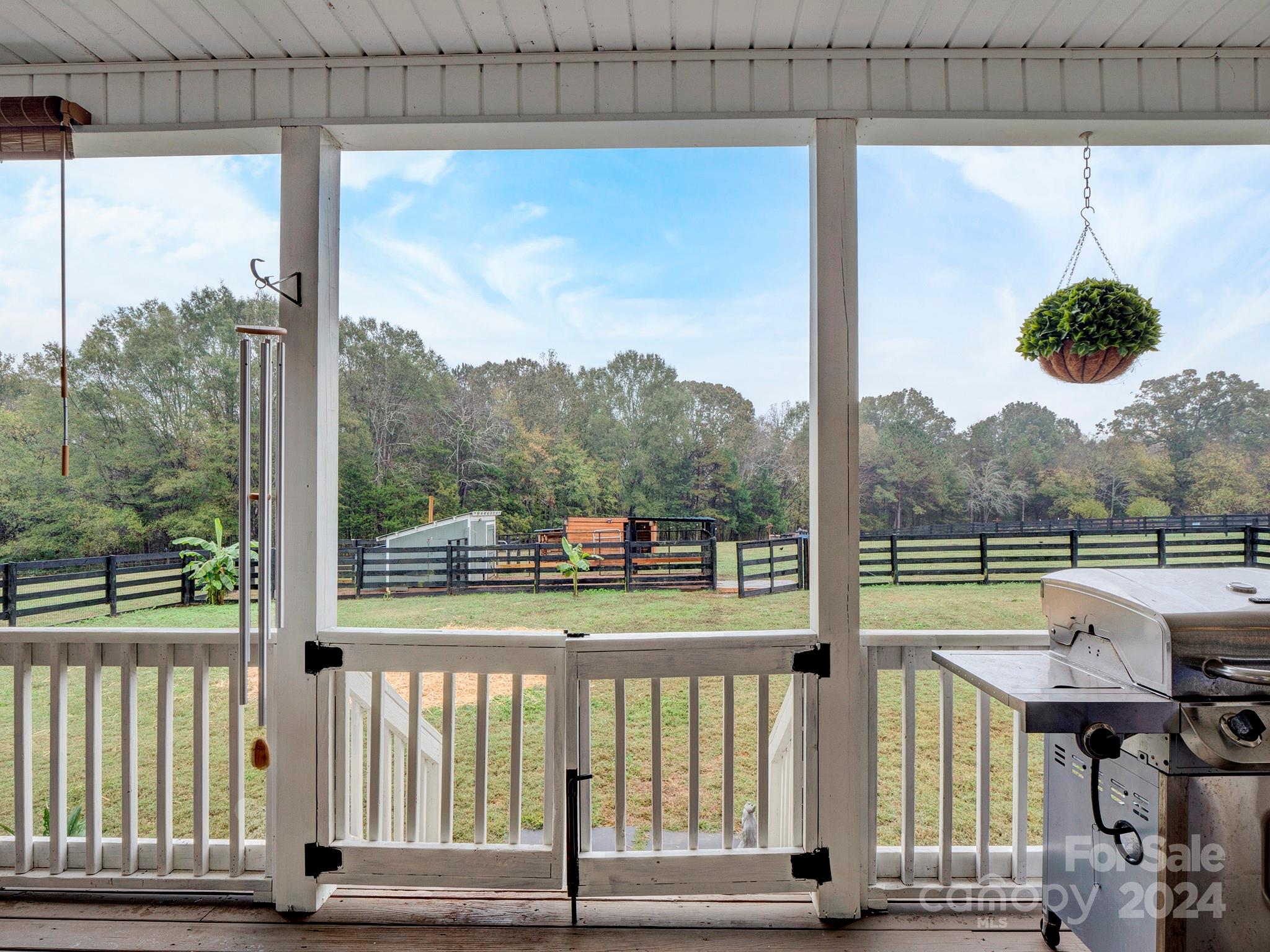 Discover the ultimate in country living! This exquisite ranch-style home features 4 bedrooms and 3 bathrooms, nestled on a sprawling 5-acre lot that beautifully harmonizes comfort and serenity. Step inside to find a move-in ready oasis, where an open floor plan showcases gleaming hardwood floors, an abundance of natural light, and impressive vaulted ceilings that grace the great room, kitchen, dining area, and bedrooms. The spacious kitchen is a chef's dream, equipped with stylish cabinetry, modern stainless steel appliances, and generous counter and storage space. Unwind on the inviting rocking chair porches or enjoy the versatile bonus room above the garage, perfect for extra living space or a home office. This meticulously maintained home is a true gem—don’t miss the chance to make it yours!