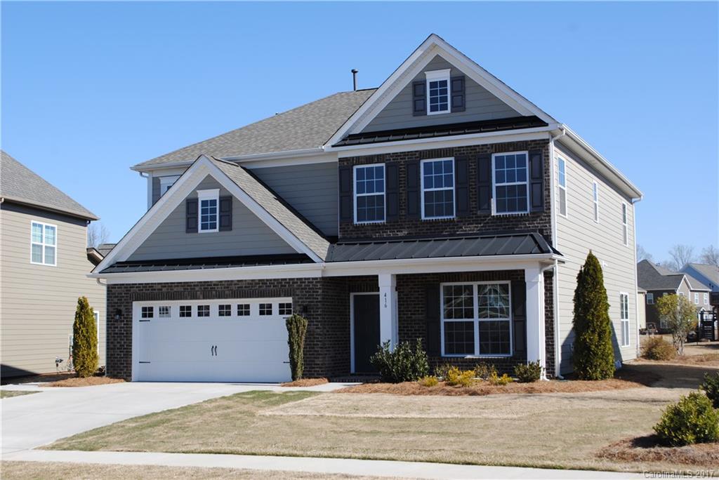 Don’t miss this opportunity to live in the popular Hanley floor plan!  Never lived-in model home has over $70,000 in enhancements.  Crown moulding throughout home and recently updated paint.  Beautiful hardwood floors on main level as well as second floor media area and Master Bedroom.  Home has upgraded wiring including whole-home surround sound and pre-wiring for wall mount televisions.  Across the street from neighborhood pocket park.  Fort Mill schools and community pool.