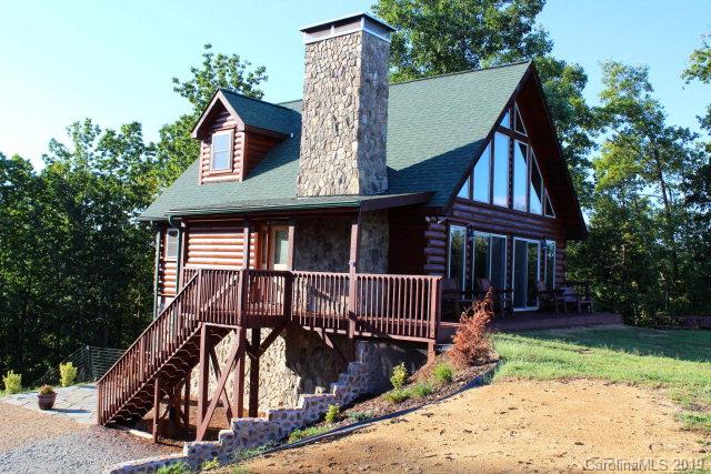 Own your own little piece of Western NC Heaven with excellent long range mountain views!  Exquisite cabin built in 2010 with privacy and also convenience to I-40 where you can easily travel to many Western NC and Blue Ridge Mountain attractions such as Asheville and the Biltmore House, Ski Slopes, Boone, Blowing Rock, Grandfather Mountain, and the Blue Ridge Parkway.  Inside you will find a pristine log cabin with a wood burning fireplace, Owner's suite on the main level, a bedroom and private bath on the upper level, and the third bedroom on the lower level with bathroom and den.  This cabin has an excellent vacation rental history.