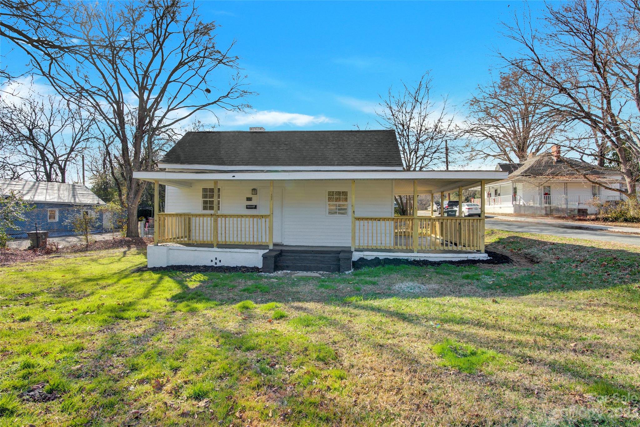 Price reduced!! Adorable one story home on spacious corner lot with NO HOA is ready for her new owner! Great for an investor (home was previously a rental property) or a first-time buyer. Tankless water heater (2020), LVP flooring, HVAC furnace/air handler (2016) and exterior HVAC unit (2024), roof/windows (2007). New front porch rails installed (2023) around entire wrap-around porch. Tons of natural light throughout and just minutes from downtown shops & restaurants, 15 minutes to Wingate University and 40 minutes to Uptown Charlotte!