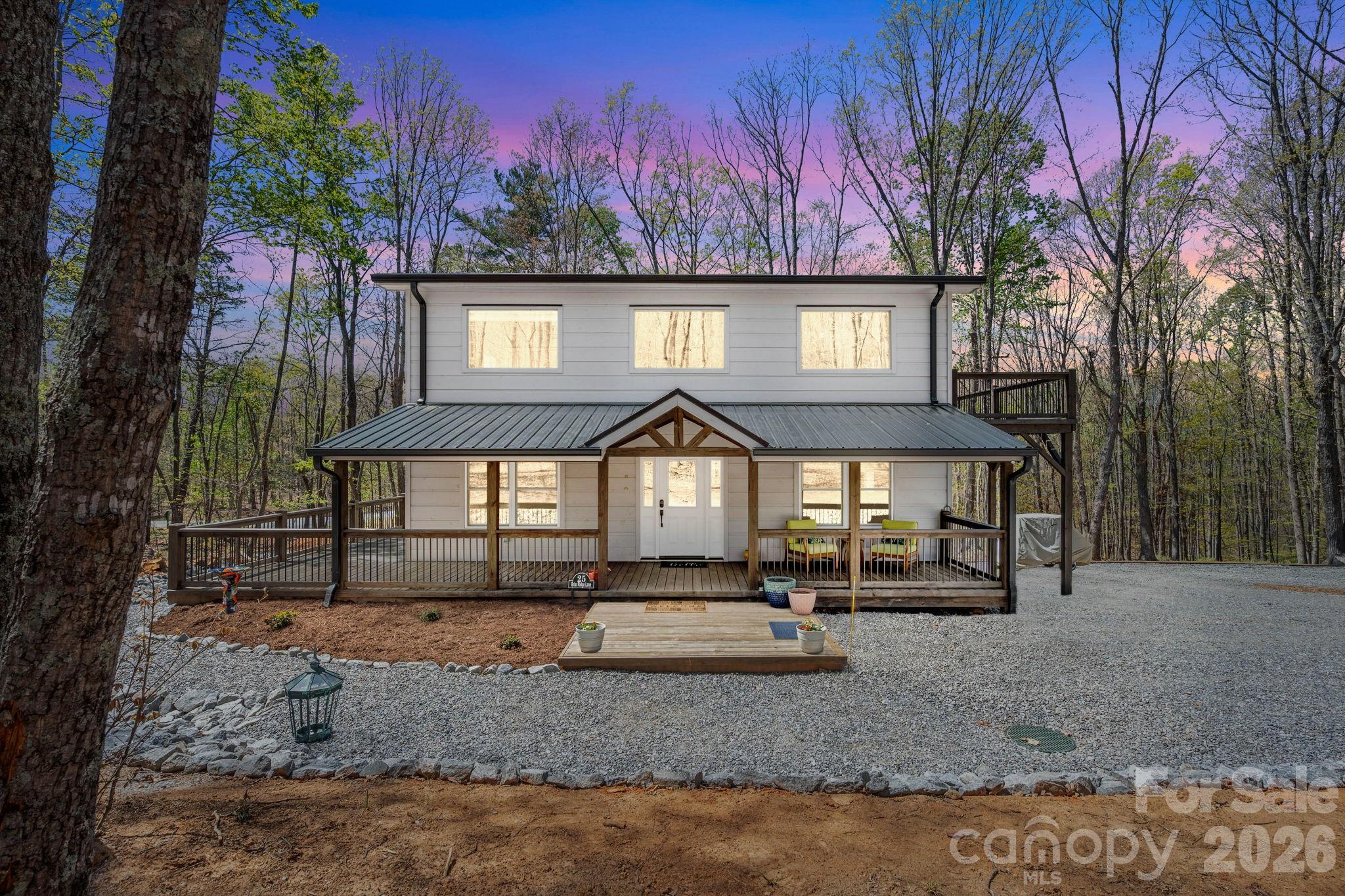 A Home and A Destination! This exquisite custom-built home blends rustic charm with contemporary elegance on a private 1.70-acre lot in the gated community of Grandview Peaks. Featuring 3 spacious bedrooms, 2 full baths, and 1 half bath, this mountain retreat is designed for comfort, privacy, and a seamless connection to nature. Relax on the covered front porch that connects to a wrap around deck and relaxing patio, and take in the peaceful mountain setting.
Inside, the open-concept great room and kitchen showcase stunning finishes and thoughtful design, creating a warm yet refined living space. The main level includes a spacious primary suite with a spa-like ensuite, along with a convenient half bath and mud/laundry area. Upstairs, an airy loft with its own private balcony offers the perfect space for a home office, reading nook, or lounge, in addition to two generously sized bedrooms and a full bath.
Grandview Peaks offers fantastic community amenities, including a lake, pavilion, recreation area, and walking trails. With short-term rentals allowed, this property is an ideal full-time residence, vacation getaway, or investment opportunity. Conveniently located between Marion and Morganton, this home offers the perfect balance of mountain serenity and accessibility.