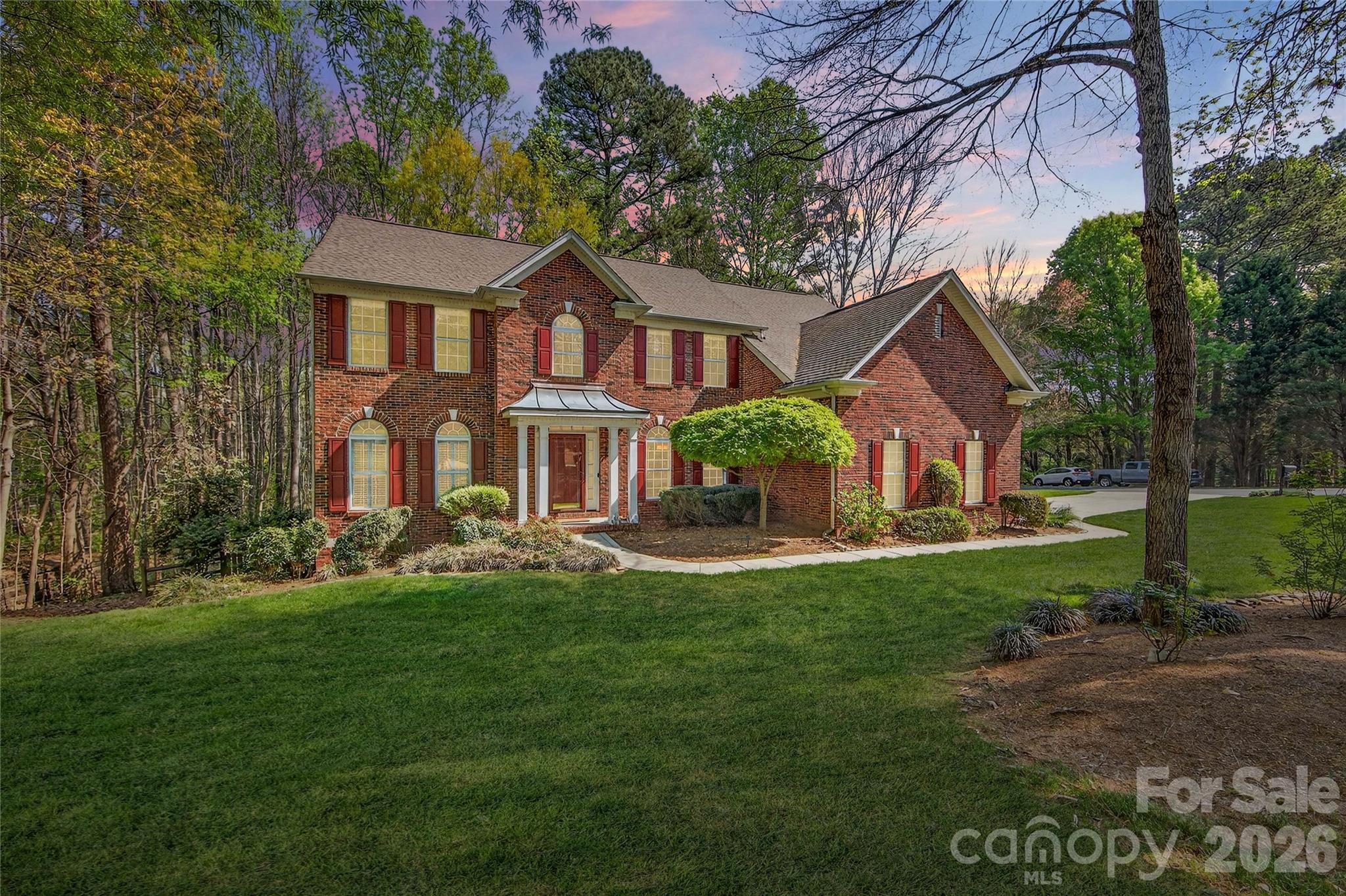 Located in the highly sought-after waterfront community of Overlook, this stunning full brick home sits on a spacious corner lot of .628 acres, offering both privacy and curb appeal. With 6 bedrooms and 5 full bathrooms, this home provides exceptional space and flexibility for modern living.

The home features a newly remodeled kitchen with quartz countertops, a stylish backsplash, and a custom wine bar complete with a beverage refrigerator—perfect for entertaining. Fresh designer paint throughout, refinished wood floors, new carpet, and smart home features including Nest thermostats add a fresh, move-in-ready feel.

Designed for convenience and versatility, the layout includes a guest suite on the main floor with an ensuite bathroom, two laundry rooms, and dual staircases. The finished walkout basement offers even more living space, complete with a bedroom, full bath, and abundant storage—ideal for guests, a home office, or multi-generational living.

Step outside to enjoy beautiful landscaping, a fenced backyard, and an oversized, multilevel deck—perfect for relaxing or hosting gatherings.

Ideally located just minutes from the airport and I-485, this home is also close to Riverbend Village, Mountain Island Lake, and the U.S. National Whitewater Center, with Uptown Charlotte only 15 minutes away for easy access to dining, arts, and professional sports.

This exceptional property combines space, style, and location in an amenity rich waterfront community—don’t miss the opportunity to call it home.