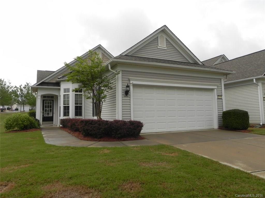 This 2BR/2BA home features an office or 3rd BR and a sunroom.  The interior has corian counters, stainless appliances, new laminate flooring,  upgraded lighting and fans.  The backyard is fenced and the expanded patio has 2 electric awnings.  It sits on a large, flat corner lot with irrigation.   Come check out this home and the active adult lifestyle of Sun City Carolina Lakes.