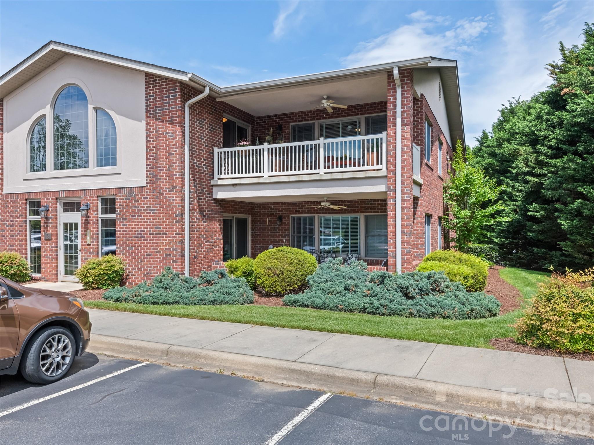 BACK ON THE MARKET WITH BEAUTIFUL UPDATES! This desirable 3BR/2BA LOWER-LEVEL end unit condo has been refreshed with new flooring throughout and updated kitchen cabinetry, creating a fresh, move-in-ready feel. If you have shown this property before, it deserves a second look!

Enjoy stunning sunsets and year-round mountain views from the covered front porch overlooking Lake Junaluska and the surrounding mountains. The open floor plan offers comfortable, easy living, with a spacious Great Room flowing into a bright Dining Area surrounded by windows that fill the home with natural light.

The well-appointed Primary Suite features a walk-in closet and private bath. Two additional bedrooms share a full hall bath with a walk-in shower, providing plenty of space for family and guests.

Located in the sought-after Lakemont community, this home offers low-maintenance living, beautiful surroundings, and convenient access to all Lake Junaluska amenities, walking trails, golf, dining, and recreation. Easy to show and ready for immediate enjoyment. Whether you're seeking a full-time residence or a peaceful mountain getaway, this refreshed condo is a must-see!