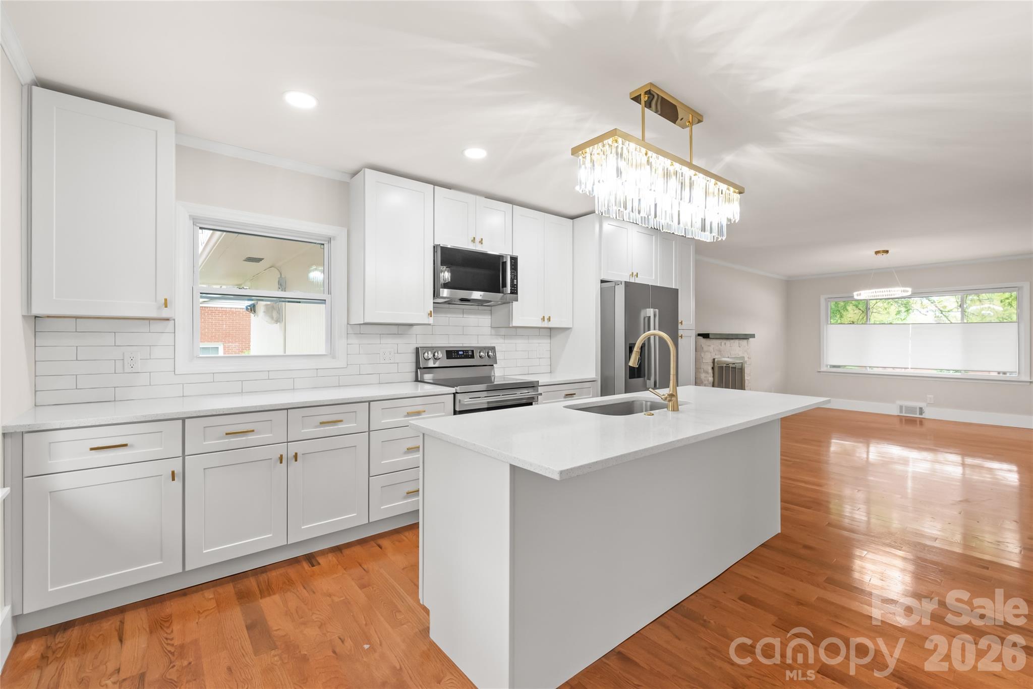 Welcome to this beautifully remodeled, move-in-ready home featuring 4 bedrooms and 2 full bathrooms—all on one level. Enjoy new hardwood floors throughout and a bright, open layout filled with natural light.
The updated kitchen boasts new appliances, quartz countertops, and plenty of cabinet space—perfect for everyday living and entertaining. A versatile bonus room off the kitchen offers the ideal space for a sunroom, office, or game room. Situated on over half an acre, the flat backyard includes a large deck for entertaining and a storage shed for added convenience. A long driveway provides plenty of parking for multiple vehicles—with no HOA.