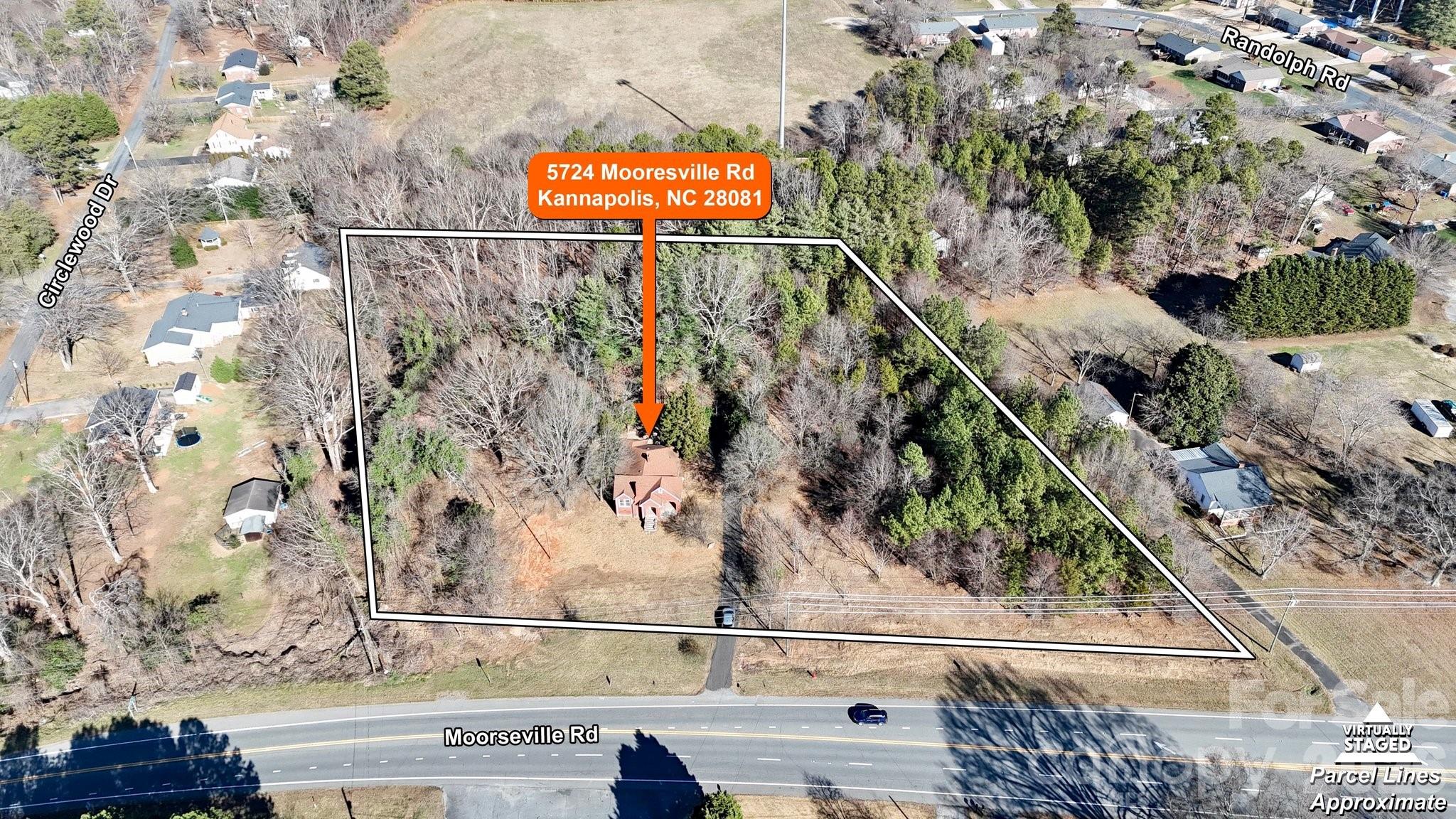 PRICE IMPROVEMENT!...Prime 4 ACRE parcel with 400ft of MOORESVILLE ROAD Frontage located a few minutes from downtown Kannapolis.  Scattered Mature Trees throughout the usable lot.  Located on property, is a 1939 brick ranch (1630 sq ft).  Home is being sold "As Is".  Not suitable for occupancy in its current condition. List price reflects the land value. This property possesses potential for future development.  Zoning LDR (P) Suitable for Greenery/Nursery business, Family Care Center and others.  Septic and Well located on this property.  Please check with zoning about other business potential for this property.  Call agent for any questions.