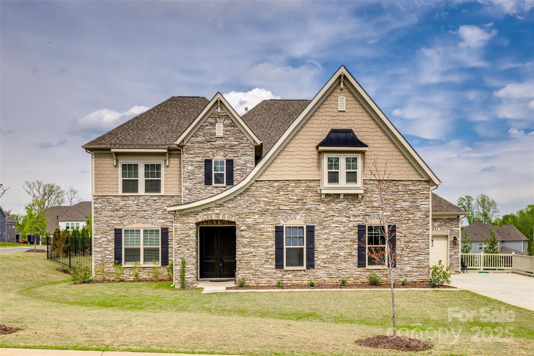 Welcome to luxury living in the prestigious and sought after 53-homesite community, The Estates at Covington! Ideally located in Indian Land, SC—just minutes from Ballantyne, Fort Mill, interstates, shopping, restaurants, top conveniences, and highly awarded schools—this Rochester plan stunner is one of the most desired floorplans in this exclusive neighborhood. Featuring 5 spacious bedrooms, 4.5 bathrooms, a dedicated office, formal dining room, bonus room, and a loft, this home has been professionally designed for both everyday comfort and effortless entertaining. The gourmet kitchen wows with a massive island, abundant neutral cabinetry, expansive quartz counters, and a walk-in pantry. Step outside to your fully fenced yard, upgraded with hardscaping and a large patio, and a screened-in covered porch, for year-round enjoyment. Nestled on a prime corner lot in the heart of the community, this thoughtfully designed home offers beauty, space, and function—inside and out!