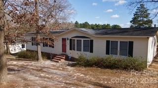 Actual address is 1337 Pate Pond Rd please use this for directions.
Welcome Home to your new scenic getaway. This 3 bedroom 2 bath doublewide has nice size primary bedroom and bath with very large walk in closet. Nice size deck to enjoy the warm weather by the above ground pool. 2 detached garages/workshops. Home has been freshly painted throughout.