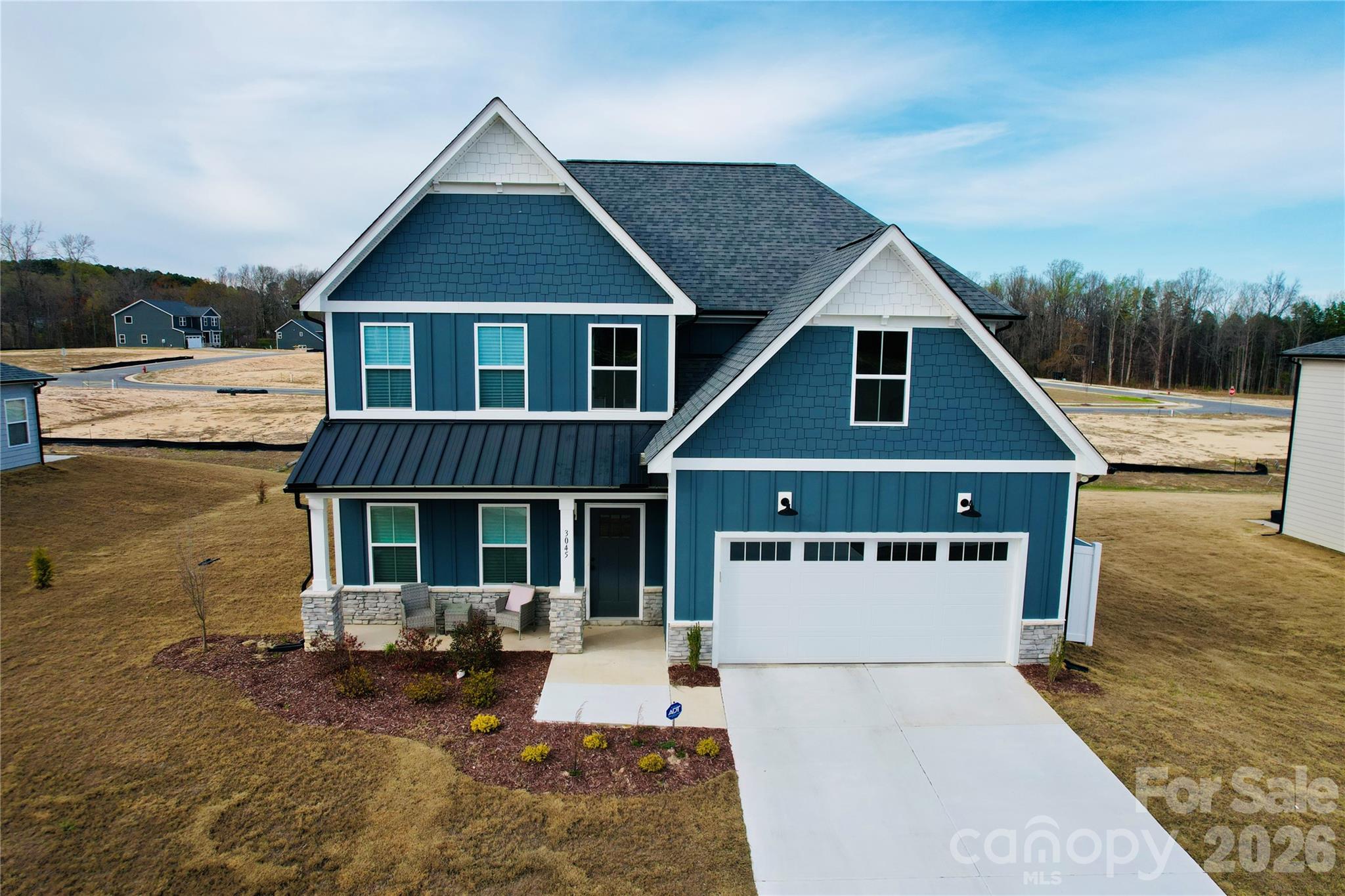 Completed and move-in ready! Built in 2024, this beautifully maintained 4-bedroom, 2.5-bath home with 2,410 square feet offers modern design and thoughtful upgrades in the desirable Monarch Meadows community in Kannapolis. The popular Willow floor plan features an open-concept layout with 9-foot ceilings, upgraded finishes, and abundant natural light, creating a spacious and inviting atmosphere throughout the main living areas.  The main level offers a seamless flow between the living room, dining area, and contemporary kitchen—perfect for entertaining or everyday living. Upstairs, the primary suite provides a relaxing retreat with a private en-suite bath, while three additional bedrooms and a convenient second-floor laundry room offer both comfort and functionality.  This property is fully completed and move-in ready, allowing buyers to skip the construction timeline while still enjoying the benefits of a nearly newer home. The home also sits on a beautiful lot with a spacious yard, offering outdoor space that many new builds in the area cannot match.  Additional features include a 2-car garage, drop zone entry, modern appliances, and upgraded details throughout.  Located just minutes from shopping, dining, and major commuter routes, this home offers the perfect blend of modern living, convenience, and value in Kannapolis.