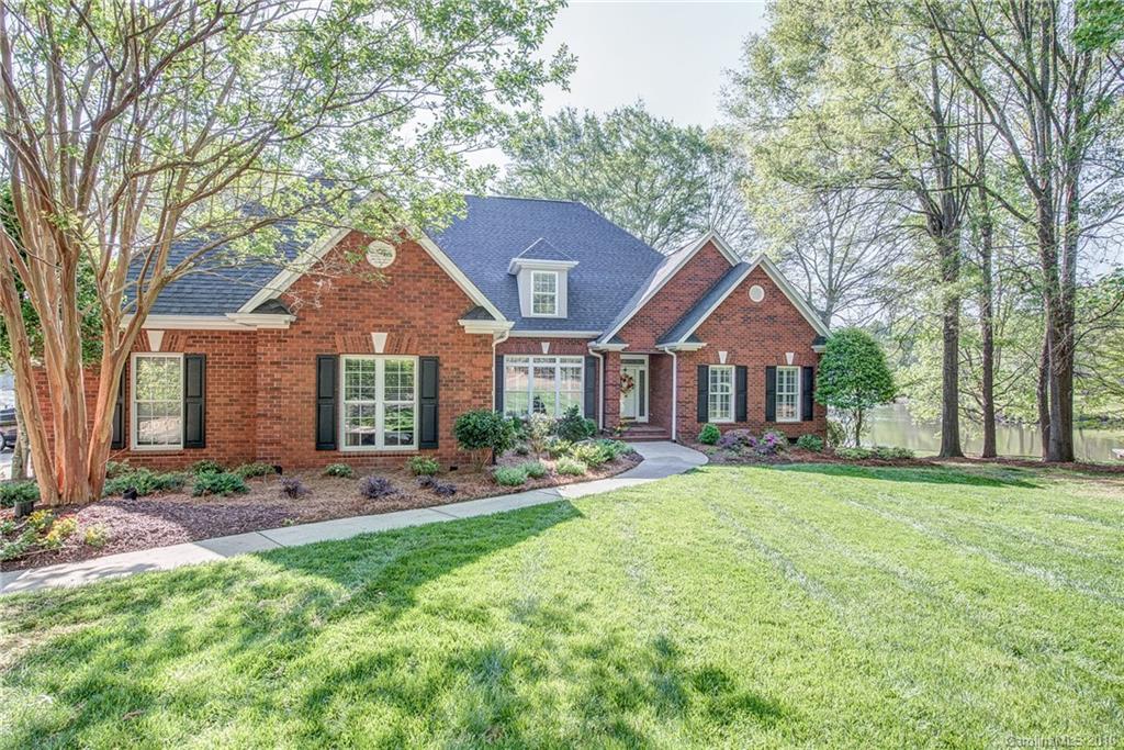 Views! Privacy! Incredible! One owner custom built on level waterfront.  Gourmet kitchen, hardwoods, huge master suite w/ his/her closets, triple garage, possible 4rd BR in exercise room w/ tons of unfinished walk in storage. Each bedroom has private full bath. Master and office on main.  High Energy efficient Geothermal Heat, Back yard fenced, full yard irrigation, pro landscaped.2016 roof, dock w/ boat lift and 2 jet ski slips, drive in boat ramp and over 400 ft of shoreline.This is it!