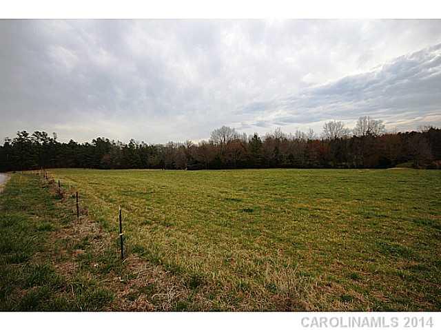 Approximately 25 acres divided from a beautiful 130 acre farm that was handed down from generation to generation.  Your chance to own a piece of history. This tract is mostly open with pasture land and wooded on back.  Located only 6 miles from Lake Wylie shopping. No HOA. No HOA fees. Horses welcome.  Build when you want with who you want or choose one of our builders.  Great Clover Schools.