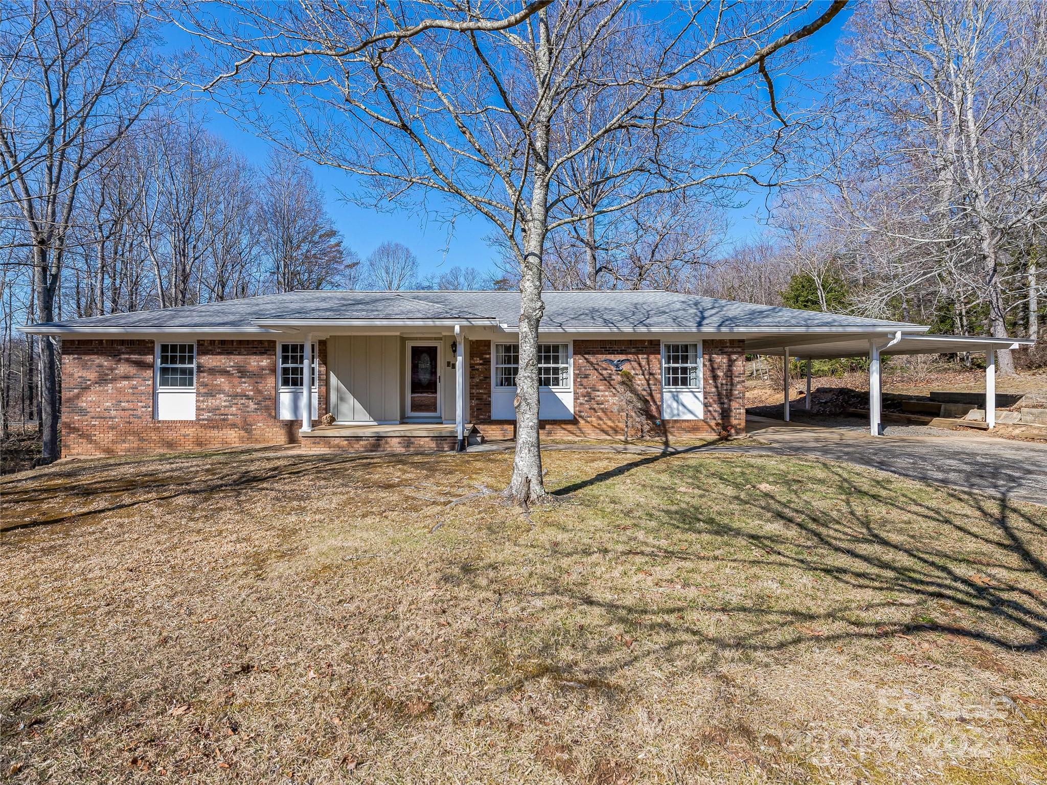 Classic 3 bedroom/2 bath mid-century ranch on ~1 acre corner-to-corner lot in Botany Woods. Bring your vision for renovation--there is so much potential and more memories to be made here! Peaceful and popular tree-filled east side neighborhood near the Blue Ridge Parkway and Swannanoa River, and just 6 miles from downtown Asheville or 15 min. drive to Black Mountain. City address, county taxes. Note carpet in living/dining room and some damaged floor tiles have been removed. Original oak floors in hallway and bedrooms. Appx. 14 year old roof, 6 year old natural gas furnace/air conditioning, electrical service update in 2018, and exterior painted 4-5 years ago. Abundant storage space in basement (outside entrance), until recently chock fill of owner possessions and workshop. Efflorescence on concrete block, however sellers have not noted any leaks or issues. *Multiple offers received. All interested buyers are encouraged to submit offers for consideration by noon Wed. 2/28.*