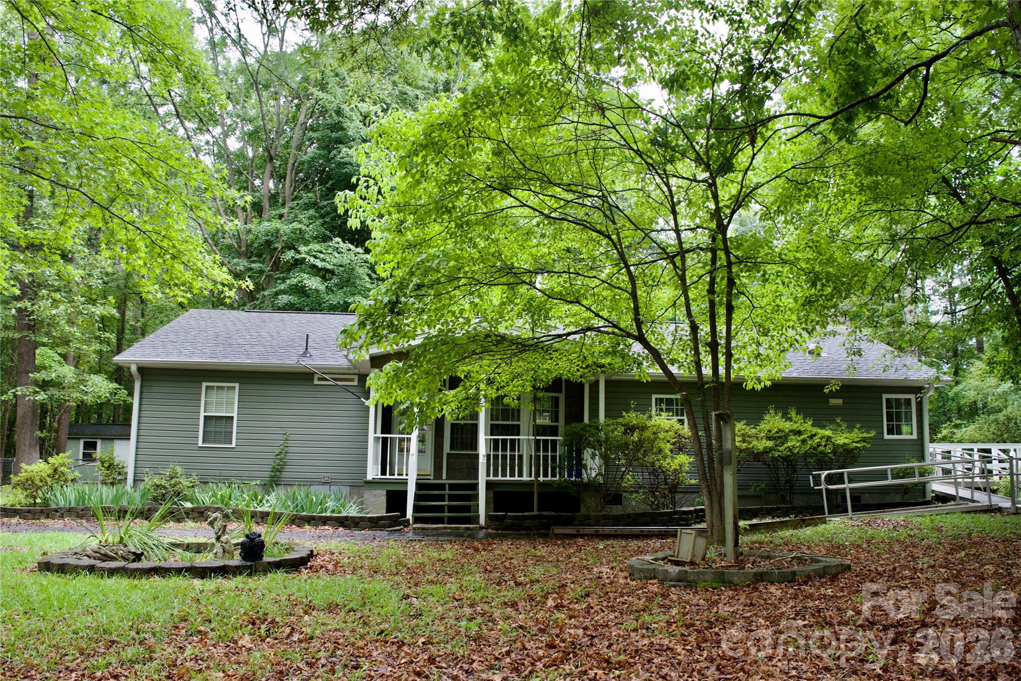 908 Buddy’s Choice is a rural retreat ready for new owners.  With a large fenced in area in the back and a green space in the front, this manufactured home has a front porch and a side deck.  Including 3 bedrooms and 2 full baths, there is plenty of room to move around, live and entertain.  In the living area, you will see a cozy wood-burning stove and built in bookshelves for item displays.  In the dining room, there are even built-in china cabinets! In the living room and kitchen, light flows in through solar tubes that illuminate the area well. With a wheelchair ramp and accessibility features, the possibilities are endless for easy living.  This mobile home has been permanently affixed and is de-titled according to Brice Law Firm in York, SC.  The property contains an easement on the far left side of the driveway (from the road) following the property line, allowing for maintenance access to the community well.  The easement follows the property line, however access has been via the driveway itself.
