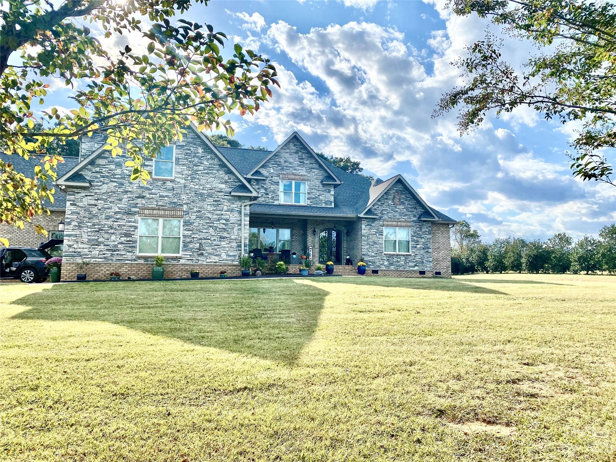 11 Beautiful Acres! Private, Custom Built brick & stone home, Vaulted GR w/ Hearth stone FP. Large Formal DR, Large office has walk-in closet, Chef's kitchen loaded w/ custom cabinetry, under cab lights, roll outs, soft close, custom, 2 walk-in pantries, BKFST, coffee bar area w/ fridge & sink. Primary suite has natural light, Huge closet- Dressing/ sitting & makeup area, Dual Vanities, SPA shower-2 heads,1 higher & shower wand, Jacuzzi free standing TUB, heated tile floor. Step out to 2 covered back porches, tiled & composite decking, natural gas line, 2 addl brs w- J/Jill bath, Hall bath leads to back deck, 10' ceilings 1st floor, Wired Surround sound, BONUS RM-7.1 surround. Cat 6 throughout. All 4 baths have custom tile floors & shower surround, granite & quartz counters- 8" faucets. Solid core doors on 1st floor. Upstairs has Large BR, Bath, Bonus, loft, tons of Attic storage! 2 separate 2 car garages-total 1,405 sf. *Can build a secondary home up to 2,500 SF. See restrictions.