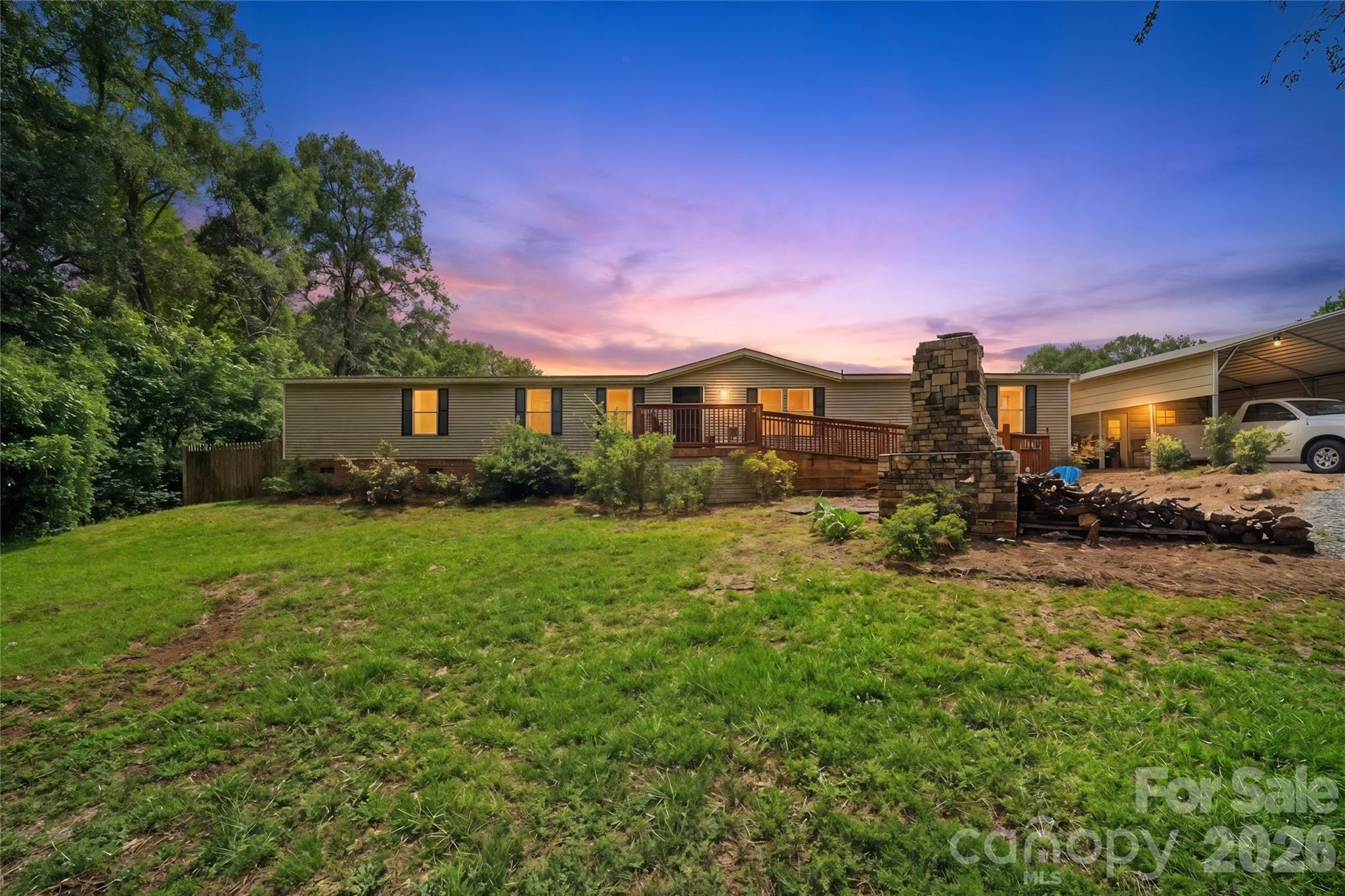 Welcome home to this beautifully refreshed, move-in-ready property offering the space, freedom, and modern updates buyers are looking for! With over 2,000 square feet situated on a generous 1.16-acre lot with NO HOA, this home delivers the perfect blend of comfort, flexibility, privacy, and style. From the moment you step inside, you will appreciate the fresh, clean, and inviting feel created by thoughtful updates from top to bottom.
The interior has been beautifully enhanced with brand-new flooring throughout, fresh paint, stylish new cabinetry, updated bathroom vanities, new lighting fixtures, and a bright, modern look that makes every room feel warm and welcoming. The kitchen shines with new stainless steel appliances and updated finishes, offering an attractive and functional space for everyday living, gathering, and entertaining. Enjoy the cozy charm of an indoor wood-burning fireplace, then extend your living space outdoors with an outdoor fireplace that sets the scene for relaxing evenings, weekend get-togethers, and memorable moments under the stars. The private backyard offers incredible potential to create your own custom outdoor retreat, garden, play area, entertaining space, or beautifully landscaped escape. Additional features include a new side deck, detached carport/shed, and plenty of room for storage, hobbies, parking, and outdoor enjoyment. With over an acre of land, no HOA restrictions, and so many major updates already completed, this home is ready for its next owner to move in, settle in, and make it shine even more. A refreshed home with space, privacy, charm, and possibility — this one is a must-see!