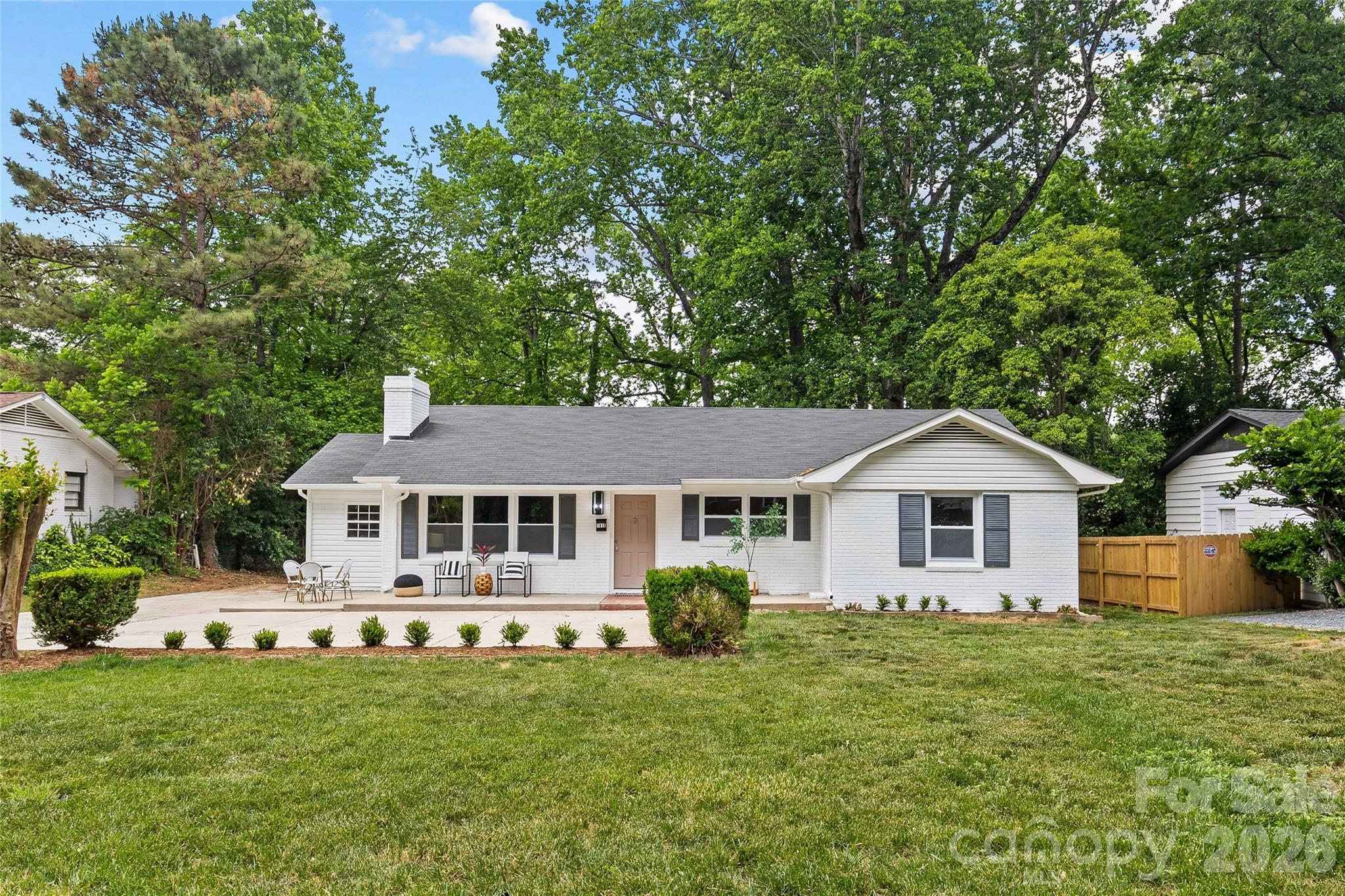 A coveted 4-bedroom, 2-bath home in the popular Windsor Park neighborhood, just minutes from Uptown Charlotte. This updated property features fresh interior and exterior paint, modern finishes, and plenty of parking on a large, flat lot with a spacious yard.  The primary bedroom offers generous space and an ensuite bath with neutral finishes and a walk-in shower. Three additional bedrooms are well-sized and share an updated hall bath.
The kitchen is both functional and stylish, with shaker cabinets, quartz countertops, stainless appliances and LVP flooring. You’ll also find newly refinished hardwoods throughout much of the home. A bright, shiplap-accented sunroom adds extra living space, perfect for a home office or mud/drop zone along with a dedicated laundry room and convenient side entry.  New landscaping completes the home, giving it great curb appeal and a move-in-ready feel.