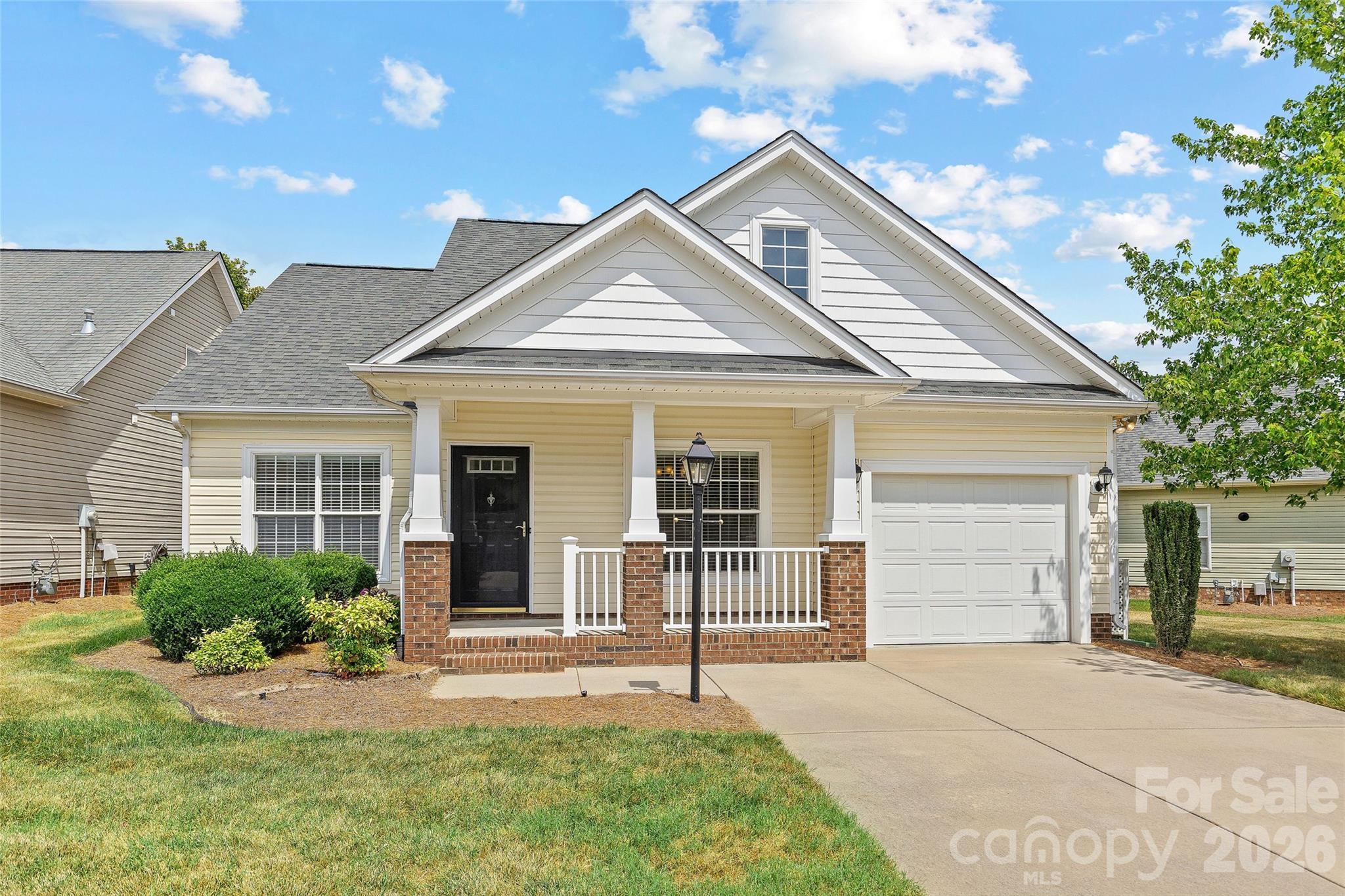 One level living in the quaint community of Curry Place. Enjoy the convenience of a flat driveway and just 2 steps up to the covered front porch. Inside you will find a dedicated dining room (that could also be used as an office/flex space). The kitchen features white solid surface counters, a tasteful tile backspace and pass through window to the living area. There is also a large double door pantry. The garage enters into the kitchen which makes grocery runs a breeze. This home has wood floors in the living areas and tile in the kitchen and baths. The bedrooms are carpeted for comfort. The primary bedroom has an attached primary bathroom with a full sized walk-in shower, large vanity and separate linen closet. The secondary bedroom is located at the front of the house offering privacy from the primary bedroom. This bedroom also has access to the hall full bathroom. The best feature of this home is the wide screened porch off the living room. Enjoy the outdoors from this spacious screened room overlooking the backyard. Privacy bushes have been planted to really make this a special retreat. Off the screened porch, there is a patio for grilling and additional outdoor living. The interior is freshly painted and this home is move in ready. Lawn maintenance is included in the low HOA dues. Come see what makes this location a hidden gem - tucked away, yet close to multiple grocery stores, restaurants and recreation, and several parks. Easy access to Stallings, Matthews, Indian Trail, I-485, and just a short drive to Ballantyne.