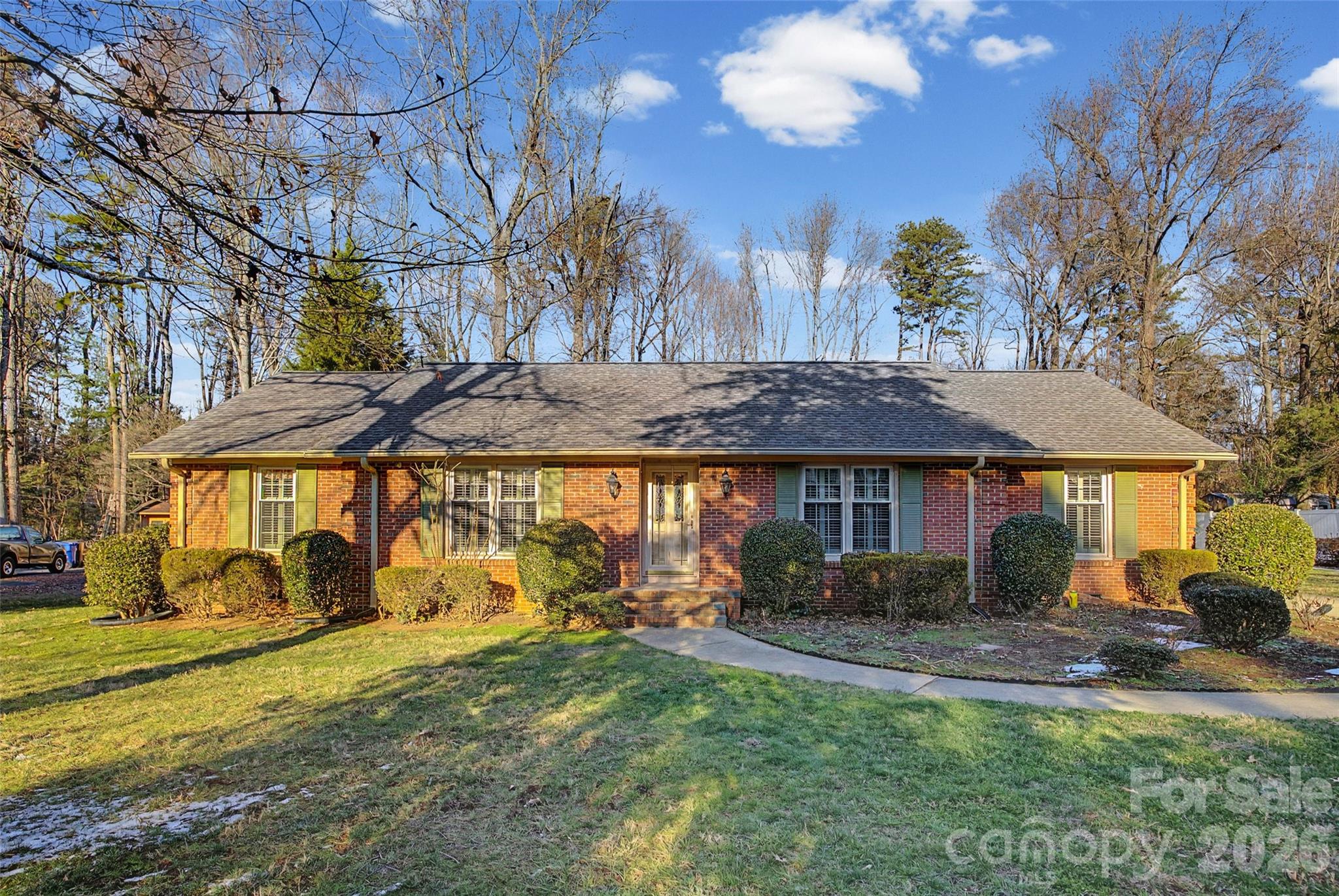 This classic Rock Hill home is full of potential and ready for its next owners.  There are few like it in the area, an all brick ranch with 3 bedrooms and 2 bathrooms and a huge flat yard.  Did I mention location?  164 Foxcroft is central to most everything in Rock Hill - downtown, hospital and medical offices, shopping, the airport and in a good location between York and Fort Mill.  When you enter this home, you will see a formal living area and dining area, a cozy den with a wood stove and a large eat-in kitchen.  The windows have plantations shutters throughout and you will find skylights in the den and the sunroom.  Even the laundry room is unique - washer and dryer included -with lots of cabinet storage.  As you go out into the backyard, you will find a large heated sunroom, a generous patio and an outdoor shed.  This house is special and when spring comes the daffodils and trees will be beautiful! In the fall, the gutter guards on the gutters will keep you from having to clean them out. Don’t miss it - this house is special!