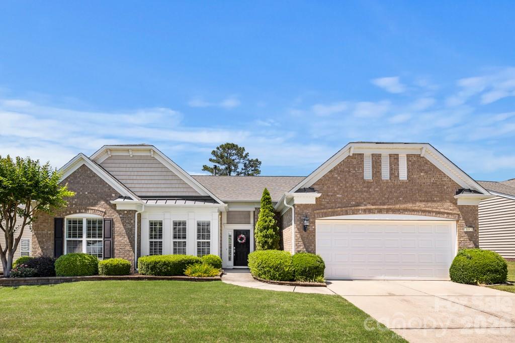 Welcome to this beautifully maintained Crestwood Meadow home in Sun City Carolina Lakes! Just off the foyer, French doors open to a private office or study, offering the perfect space for remote work or quiet relaxation. Two spacious secondary bedrooms and a full bath are tucked along the hallway, providing comfort and privacy for guests.

The heart of the home features an open-concept layout ideal for both everyday living and entertaining. The great room is highlighted by a gas log fireplace with elegant mantle and picture frame molding details, while the formal dining area with tray ceiling and chandelier adds a touch of sophistication for gatherings and special occasions.

The kitchen is designed with both style and function in mind featuring granite countertops, stainless steel appliances, tile backsplash, a large island with seating, and seamlessly flows into the breakfast area and sunroom. Natural light fills the space, creating warm and inviting views of the backyard.

Privately located at the rear of the home, the spacious primary suite offers a relaxing retreat with an ensuite bath that includes a dual sink vanity and walk-in glass shower.

Outdoor living is just as inviting with a custom paver patio perfect for enjoying peaceful Carolina evenings in the private backyard, framed by mature shade trees with views of the lake beyond.

Living in Sun City Carolina Lakes means enjoying resort-style amenities including golf, indoor and outdoor pools, tennis and pickleball courts, walking trails, water access, and social clubs!