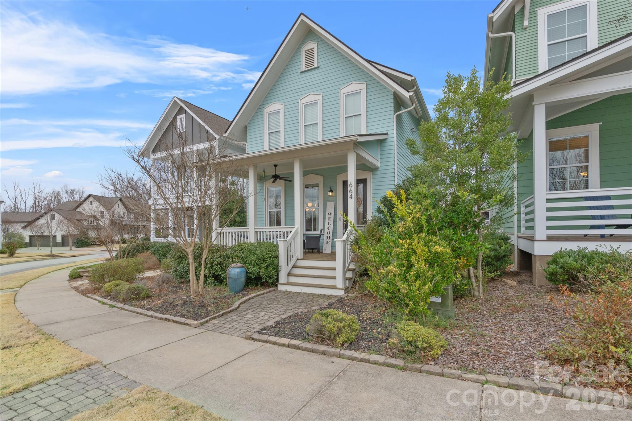 Move-in Ready! Fresh Paint Throughout, New Landscaping, Abundance of Neighborhood Amenities! The only thing missing is YOU! Nestled in the Riverwalk community along the Catawba River, this two-story residence offers 3 bedrooms, 2.5 bathrooms, and 1,922 sq. ft. of living space. The open floor plan features site-finished hardwoods, 9-ft ceilings, upgraded lighting, and home automation features. A gourmet kitchen boasts quartz countertops, a gas range, and a large island. The great room, complete with a cozy fireplace, is perfect for entertaining. The primary suite includes a walk-in closet and a spacious shower. Enjoy outdoor living with a relaxing front porch and a private backyard patio. A detached two-car garage adds convenience. Riverwalk offers a variety of amenities including outdoor recreation like miles of trails, access to the Catawba River for kayaking, and athletic facilities such as the velodrome and a BMX track. This walkable neighborhood has it all. Make it your home today!
