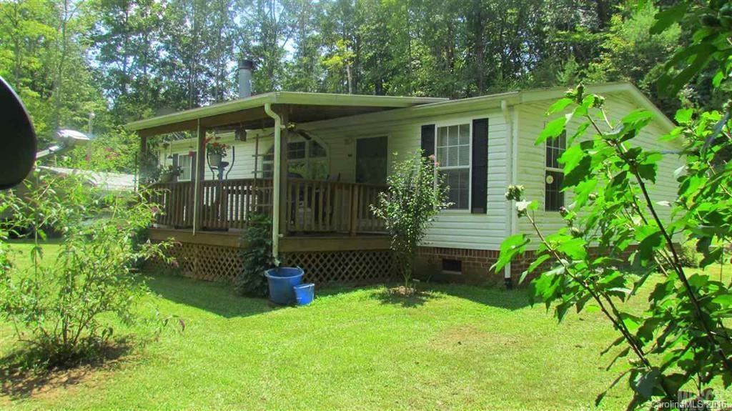 4.9 Acres, CREEK runs through property, quaint & tucked away, Ellendale township, Lg outbuilding wired for electric, covered front porch, tool shed, carport, garden area, and lots of birds for bird watching! Inside features a large and open living room with gas log FP, Kitchen with range, dishwasher, microwave and refrigerator, and nice cabinets. There is an eat in breakfast area with two windows. Master BR has a WIC, master bathroom with large vanity and shower/tub combo!