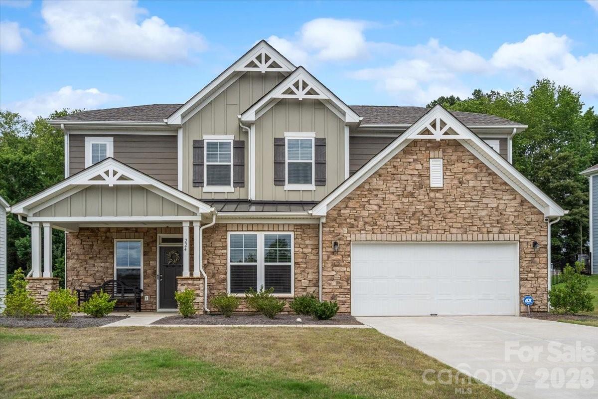 GORGEOUS home tucked away in the rural setting of Troutman's Sanders Ridge community, while only 3 miles from your I-77 commute! Set on over a quarter-acre lot with cleared green space & backing to a tall mature forested backdrop.  Stylish customizations include pendant lighting, soothing paint colors, decorative accent walls, ceiling fans, & fully fenced-in yard! Main level open floor plan including kitchen with island, informal dining space, living room, & office/formal dining/flex space with a vaulted tray ceiling. Main floor is complete with mud room featuring drop zone, a spacious guest bedroom, & full bath. Upper level opens up to loft space, master bedroom en-suite with vaulted tray ceiling, his-&-her bathroom vanity, tile shower with glass panel doors, & large walk-in master closet.  3 additional upstairs bedrooms, 2 additional bathrooms, & laundry room round out the upper level.  Home comes fully equipped with refrigerator, washer/dryer, all 3 wall-mounted TVs, & home security system including doorbell camera, plus 2 additional exterior security cameras.  Truly turn-key & move-in ready!
