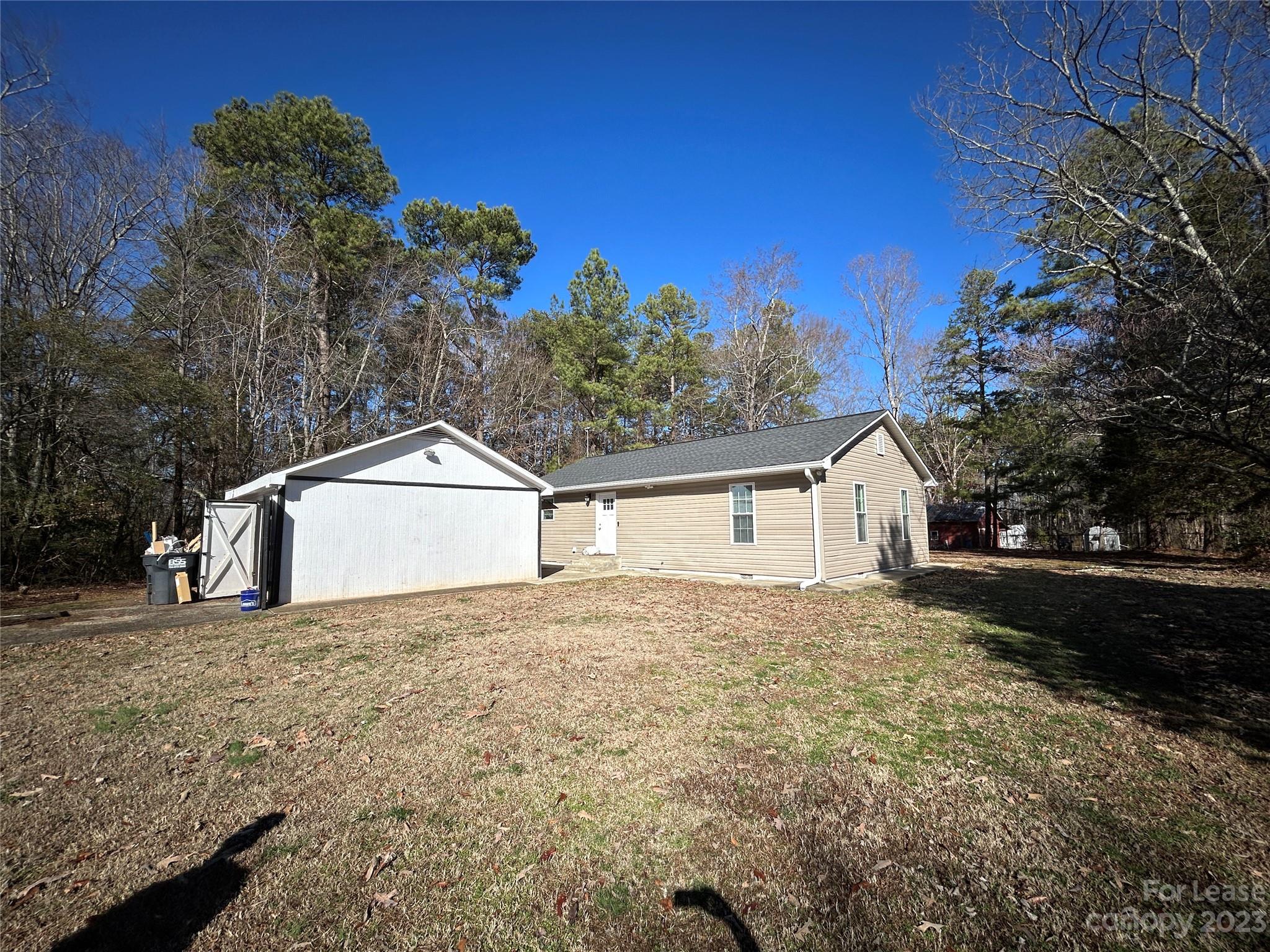 MOVE IN READY!!!  SUPER RARE find, just like NEW. Beautiful, Completely Remodeled home that is a 3 bedroom 2 bath, Open Floor Plan, Large Kitchen Pantry, with a separate on-site Garage on over a 1/2 acre Lot in the sought after location very close to charming downtown Troutman and Lake Norman State Park! The New Upgrades include Luxury Vinyl Flooring throughout the living area, two remodeled bathrooms and QUARTZ countertops.  The Primary Bedroom includes a spacious Closet! Private Large Backyard!