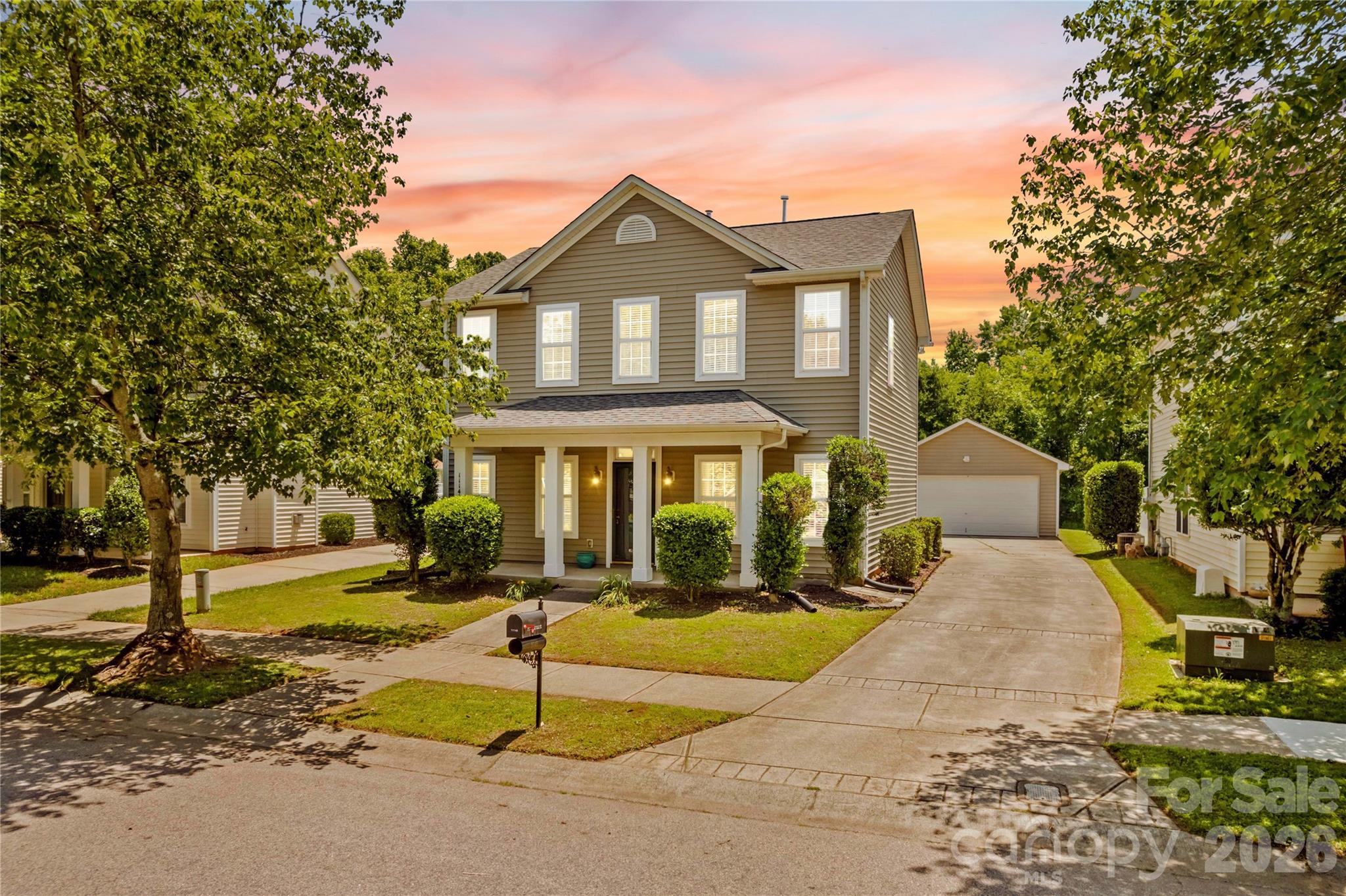 Welcome to this beautiful two-story home in the Heritage Green community of Cornelius. Offering 3 beds, 2.5 baths, and approximately 1,737 square feet of living space, this home combines comfort, functionality, and outdoor enjoyment in a convenient location. Home and carpets were just professionally cleaned and fresh paint throughout makes this home truly move-in ready! 

The inviting front porch creates a warm first impression and leads into a thoughtfully designed floor plan featuring spacious living and dining areas, durable flooring, and abundant natural light. The kitchen has been updated with newer appliances and offers ample cabinet storage and a pantry. A convenient main-level laundry location and half bath add to the home's practicality.

Upstairs, the primary suite features a walk-in closet and private full bath. A unique pass-through connection from the primary closet to a secondary bedroom provides flexible use and convenient access. Two additional bedrooms and another full bathroom offer space for guests, a home office, hobbies, or everyday living.

Step outside to enjoy multiple outdoor living areas, including a rear covered patio, charming front porch, and fire pit area. The backyard is enhanced with ample green space and easy access to Caldwell Station Creek Greenway located behind the property. Additional storage and parking are provided by the detached two-car garage, thoughtfully tucked behind the home, along with a concrete driveway.

Residents of Heritage Green enjoy access to community amenities including a neighborhood pool and playground. Conveniently located near shopping, dining, parks, and schools, this home offers easy access to everyday conveniences while maintaining a welcoming neighborhood atmosphere.

Don't miss this opportunity to own a home with appealing indoor and outdoor living spaces.Lender leasing options available with Stephanie Gates at Top Elite Home Loans.