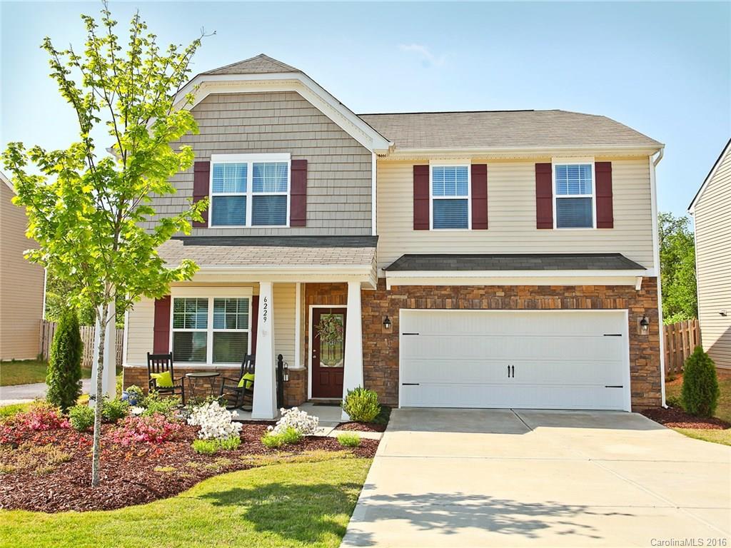Here's a Stone Accented Beauty in a Swim Neighborhood, You Don't Want to Miss! Wonderfully manicured, professionally landscaped lawn.  Travertine back Patio for Grilling out. Open floor plan with hardwoods. Kitchen has it all: rich, staggered height cabinetry, granite countertops, tile back splash, center work island, and Stainless Steel appliances. Study with glassed French doors. Versatile Loft. Elegant Master. Full Laundry Room. Charming Front Porch. SUPER Location!