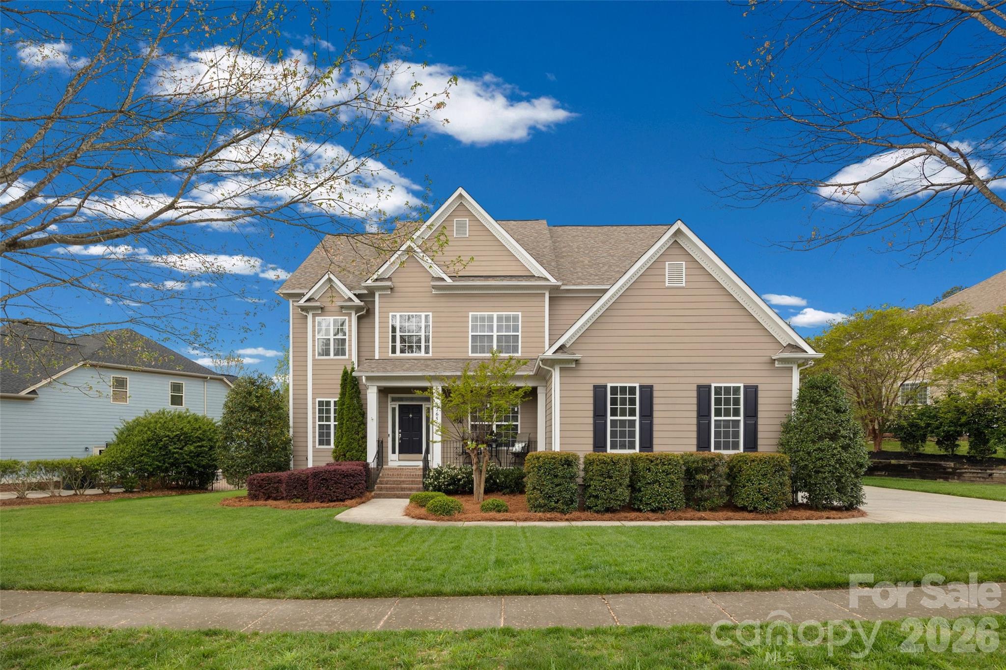 Beautiful home in sought-after Tega Cay, SC featuring 5 bedrooms, 3.5 baths, a 3-season room, and a large deck perfect for relaxing or entertaining. Meticulously maintained inside and out, this home reflects true pride of ownership and thoughtful care throughout. The bright, inviting kitchen features freshly painted white cabinetry and flows seamlessly into the main living spaces. The main level offers beautiful hardwood floors and a welcoming layout with an office, dining room, family room, keeping room, and kitchen, plus surround sound in the main living area, kitchen, and deck. Upstairs, you’ll find new carpet and generously sized secondary bedrooms, including a Jack-and-Jill bath plus an additional bedroom with an updated guest shower. The oversized primary suite offers a private sitting room, a huge walk-in closet, and a beautifully remodeled shower with dual vanities in the primary bath. Additional features include a 3-car garage with a large loft, tankless water heater, water filtration system, roof replaced in June 2020, LeafFilter gutter protection (July 2024), professionally cleaned tile, an in-ground basketball hoop, and a well-maintained HVAC system serviced every 6 months.