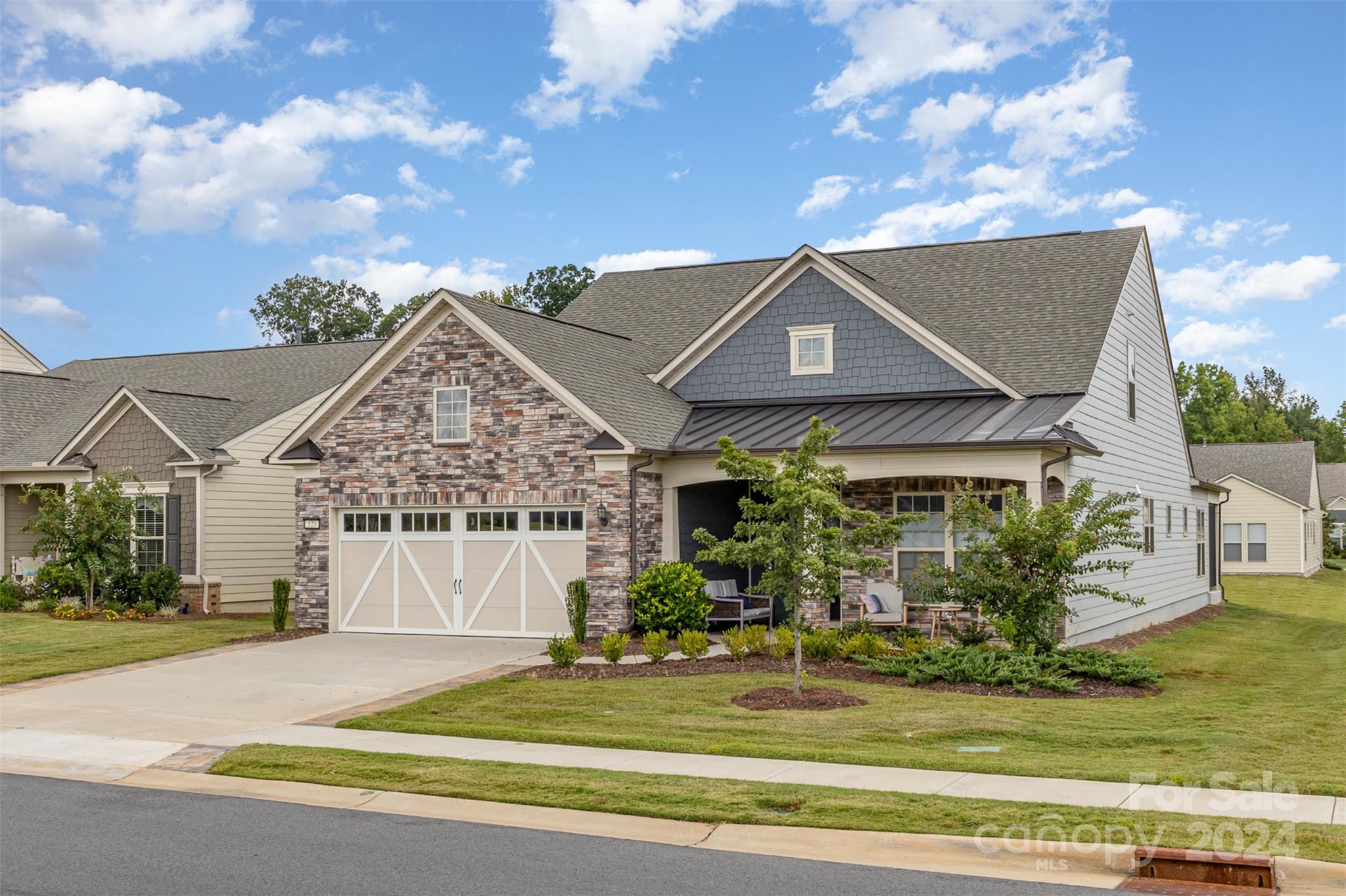 Spacious open floor loaded w/upgrades!, paver patio in back & stone work in front!  Garage floor & 3-season room have epoxy coating. Office W/French doors for privacy, extra Golf Cart Garage space & endless storage. Gourmet Kitchen w/island, butler pantry, solid wood shelves in walk-in-pantry, granite counters, SS Kitchen Aid appliances, under counter lighting, gas cook-top, under sink hot water heater, double ovens & Dining Area. Freshly painted main level, patio & 3-season closed-in porch W/vinyl windows! Extra outlet in 2 closets.  Mill work/Wainscoting in BD & office on the main floor.  Spacious primary Suite includes large walk-in closet, tray ceiling, dual vanities & oversized upgraded walk-in shower w/rain shower-head & quartz counters. Add. BD & bath on main. Upstairs boasts large loft, 3rd bedroom, full bath & huge walk-in attic storage. Amenities: Fitness Center, Yoga Studio, Dog Park, Indoor/Outdoor Pools & Hot Tubs, Tennis, 8 Pickle-Ball courts, Bocce,  play area & More!