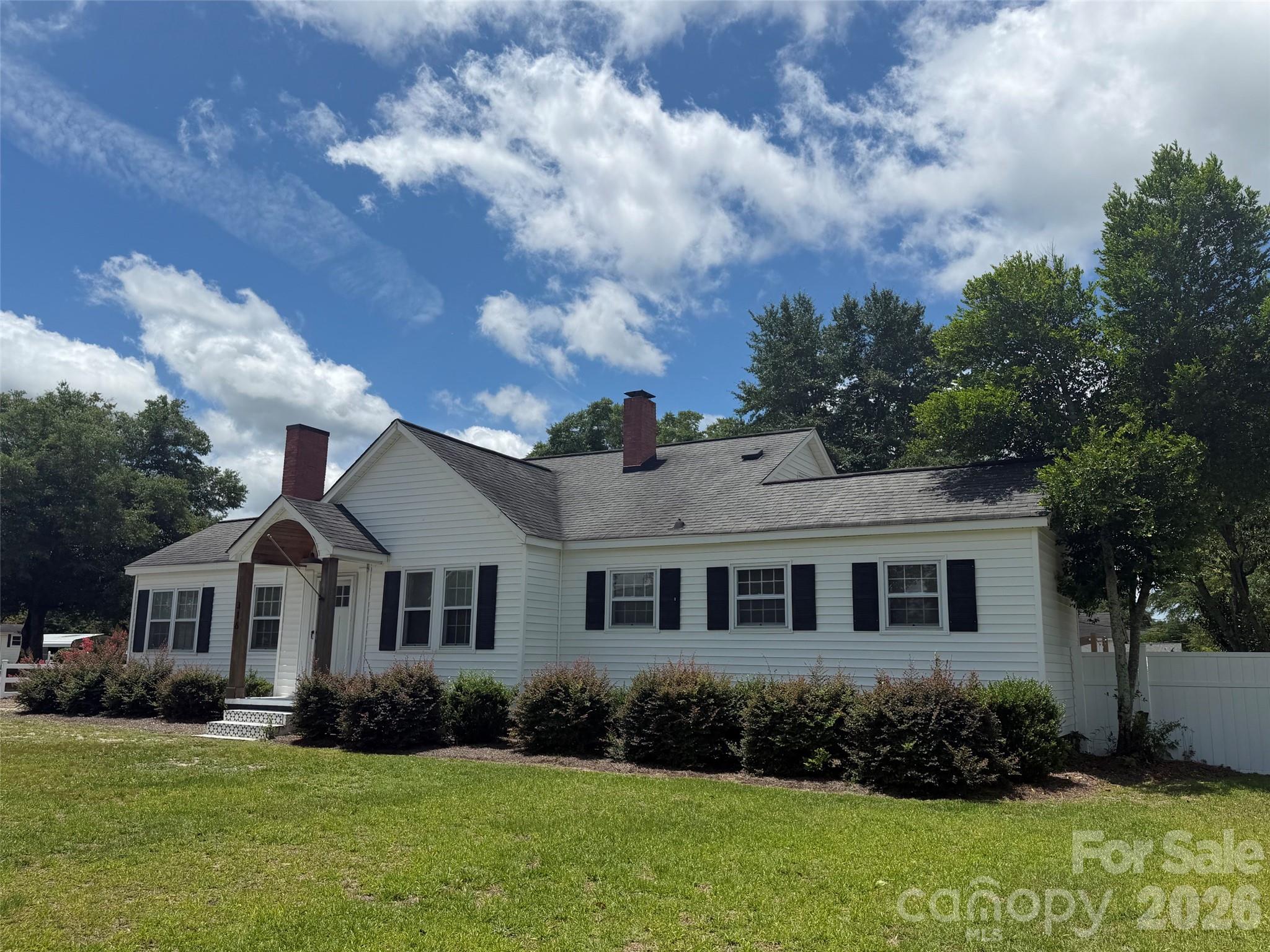 Welcome to this adorable 3 bedroom / 2 bath home located on a desirable corner lot in the charming Town of Kershaw. The home features an open floor plan with a spacious kitchen and dining area. Lots of cabinet space and storage. Fireplace with option for ventless gas logs, hardwood floors, ceramic tile and shiplap.
There is additional space that can be used as a sunroom or an office. Step outside into a huge back yard that is totally fenced in with white vinyl privacy fencing.... Lots of room for adding a pool or an entertainment area.
don't miss this one. So much character and convenient to shopping.