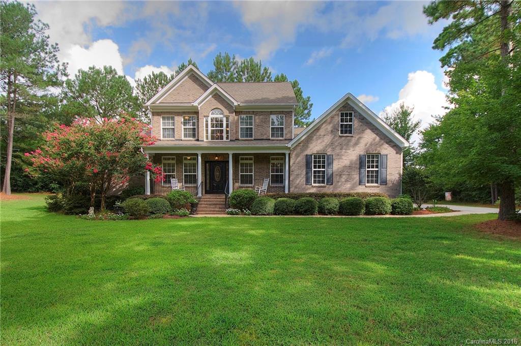 Beautiful 4-bedroom home in Mariners' Bluff, less than a mile from the Allison Creek boat landing! You'll love living in this lake community, with walking trails and picturesque views throughout the neighborhood. Home has formal dining and parlor, great room open to the kitchen. Main level master bedroom, plus three bedrooms upstairs.  Master bath has his-and-hers vanities, walk-in shower and large whirlpool tub. Spacious screened porch and deck overlooking grove of trees and lovely landscaping.